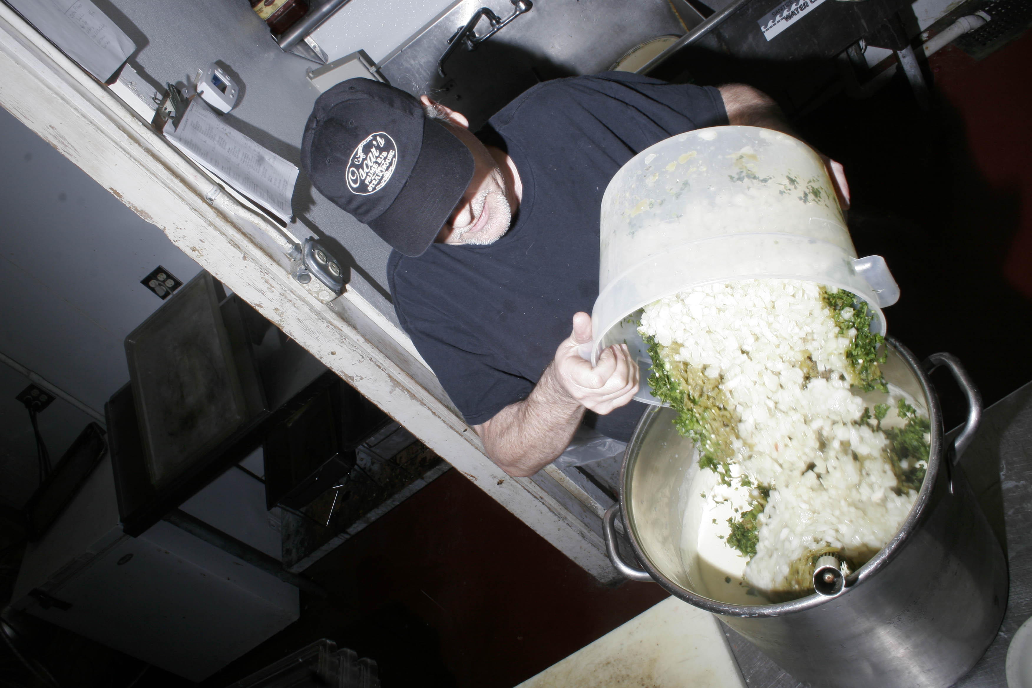 Dennis Williamson, kitchen manager, who's been there 20 years is adding the secret ingredients...