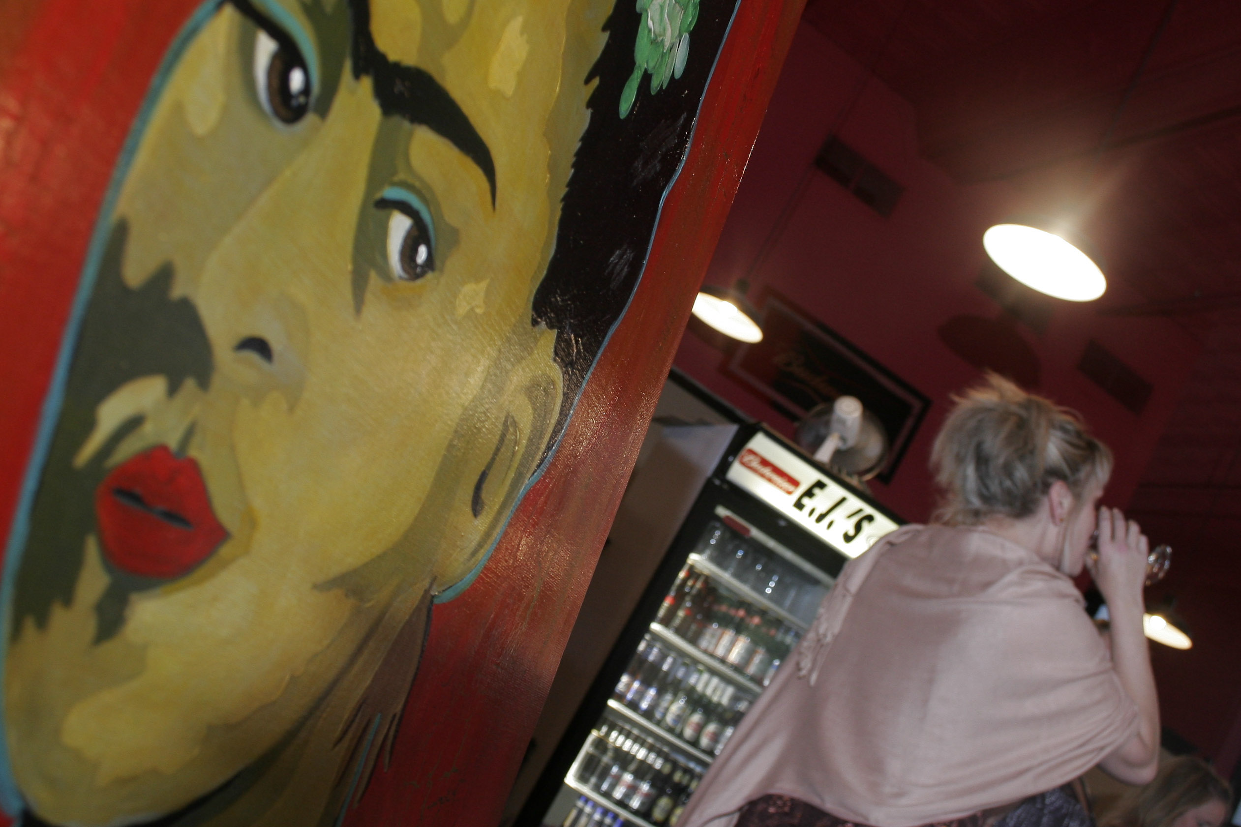 Works by Little Rock artist Stephano were on display with photographs by John Bridges during a showing at EJ's in downtown Little Rock Thursday