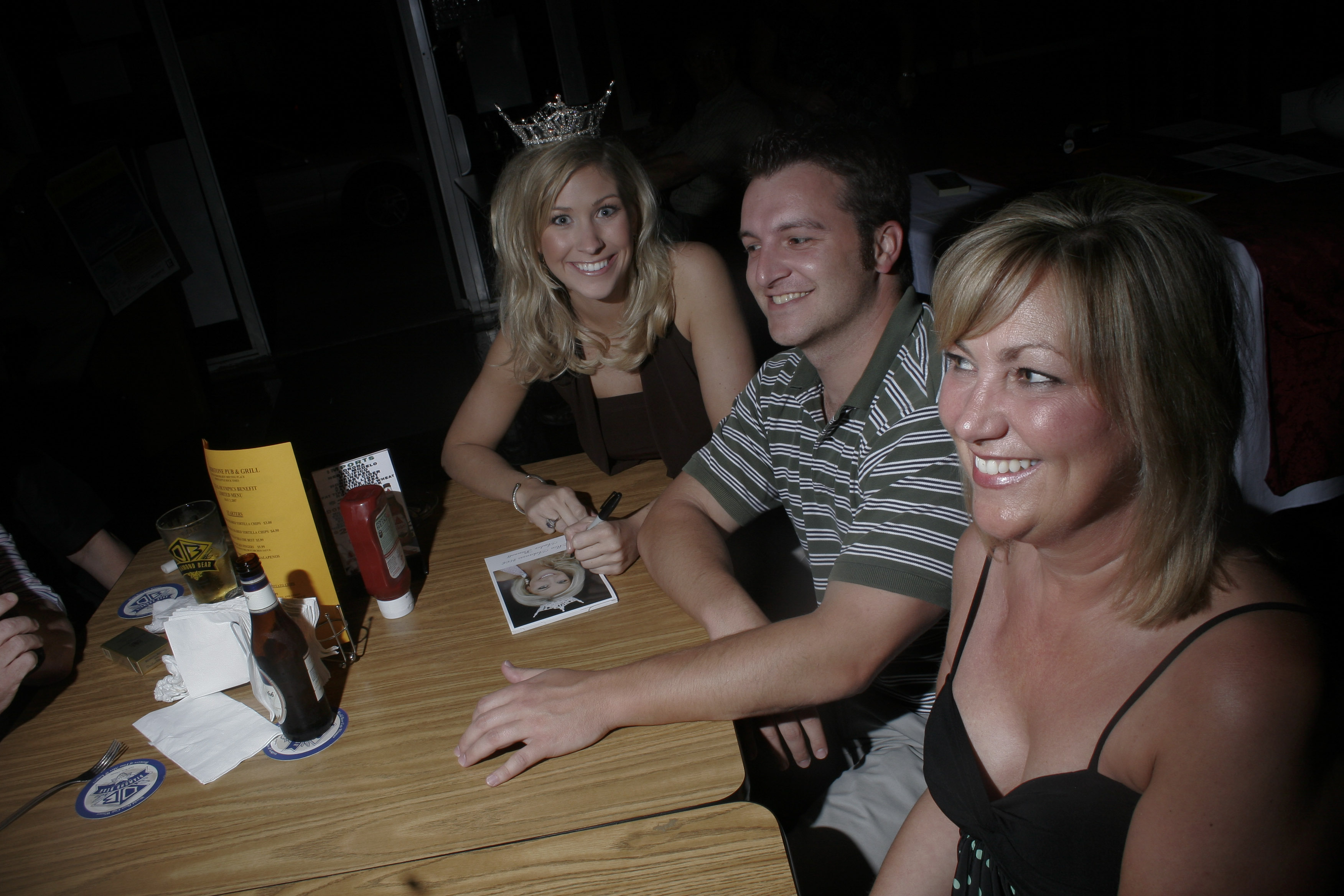 Crowds filled tables and the bar at Cornerstone Pub Thursday during a funraising event for Special Olympics, where Miss Arkansas 2006 signed autographs.