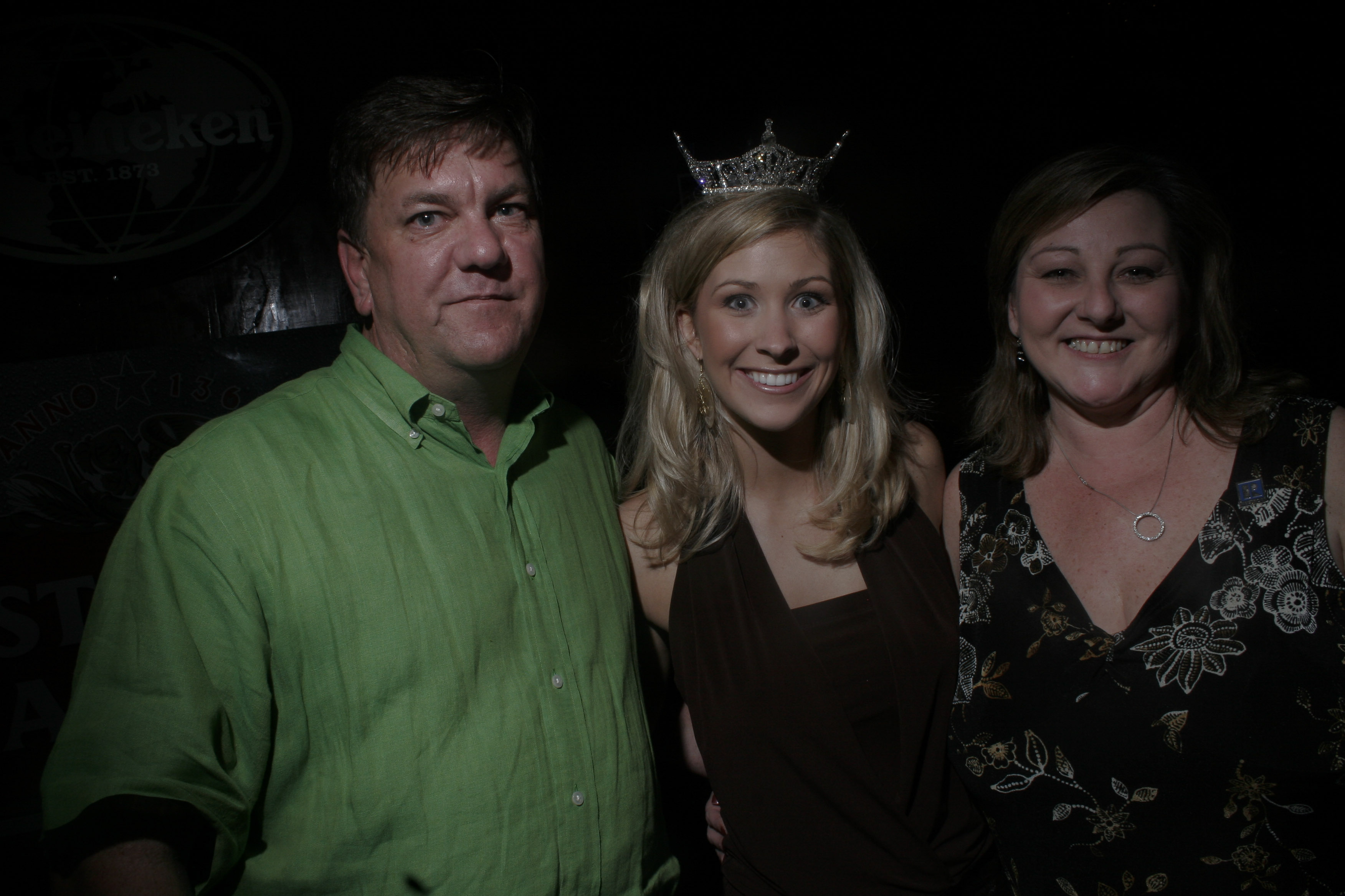 Bruce Martin (left) poses with Miss Arkansas Amber Bennett and Penne Reeder (right), who was hostess of the event.