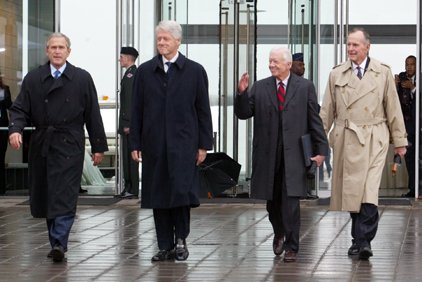 President George W. Bush , Former Presidents Bill Clinton, Jimmy Carter and George H. W. Bush walk toward the speakers platform before the Clinton Library Dedication in Little Rock in this 2004 file photo. 