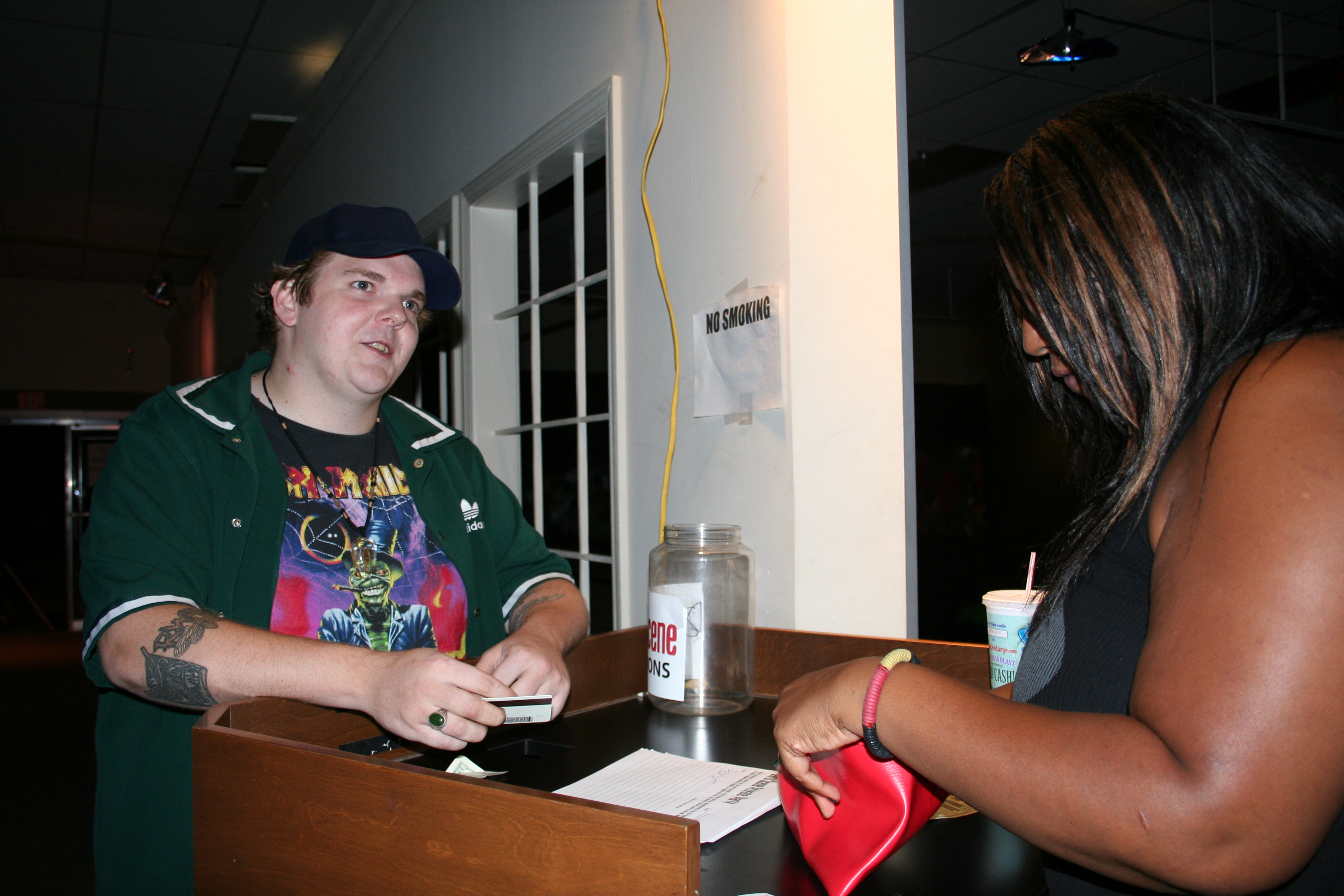 Clark pays his admission to the ArtsScene gallery on Friday, June 8.