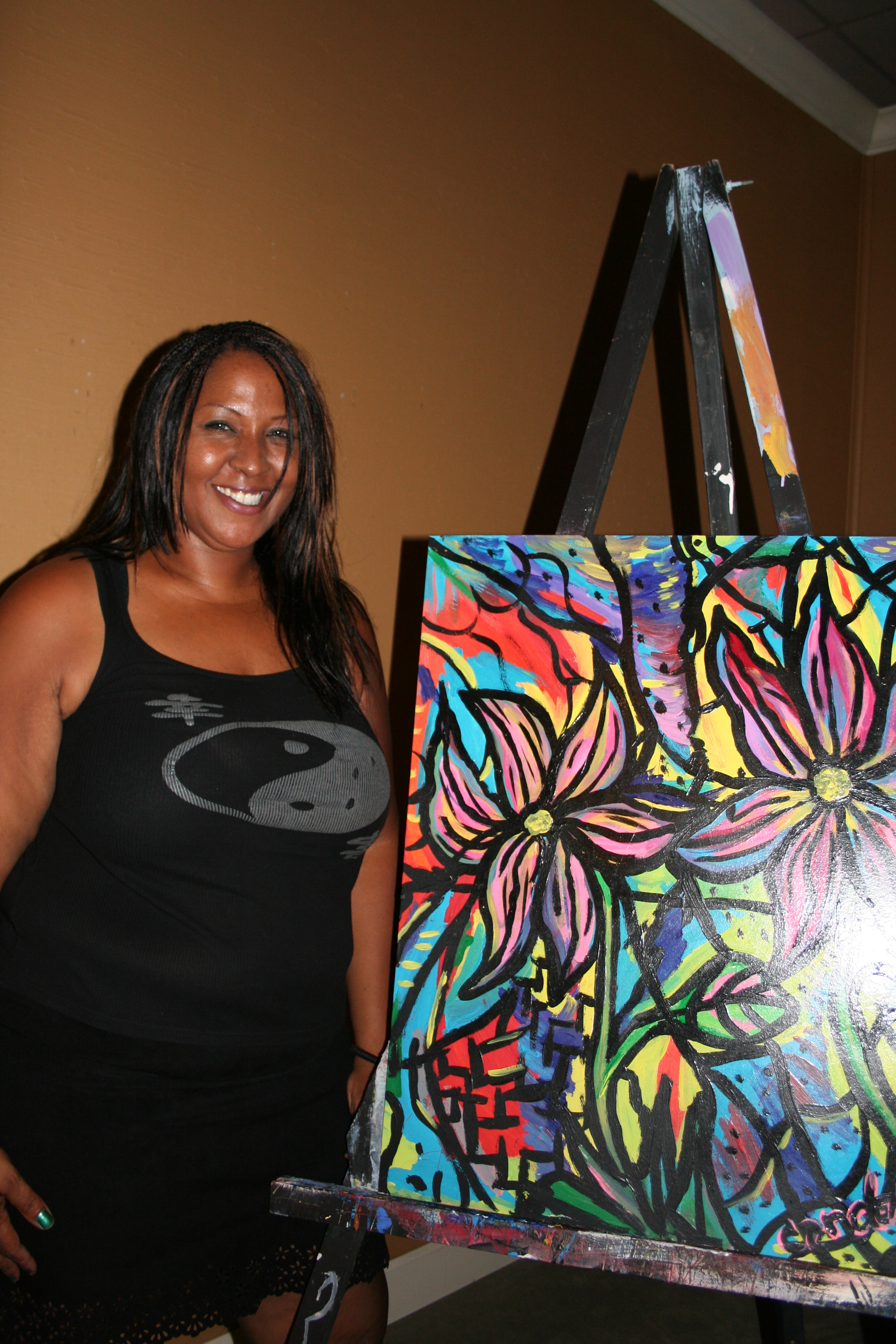 LeeAnn Bonton greets visitors at the door of the ArtsScene Art Party