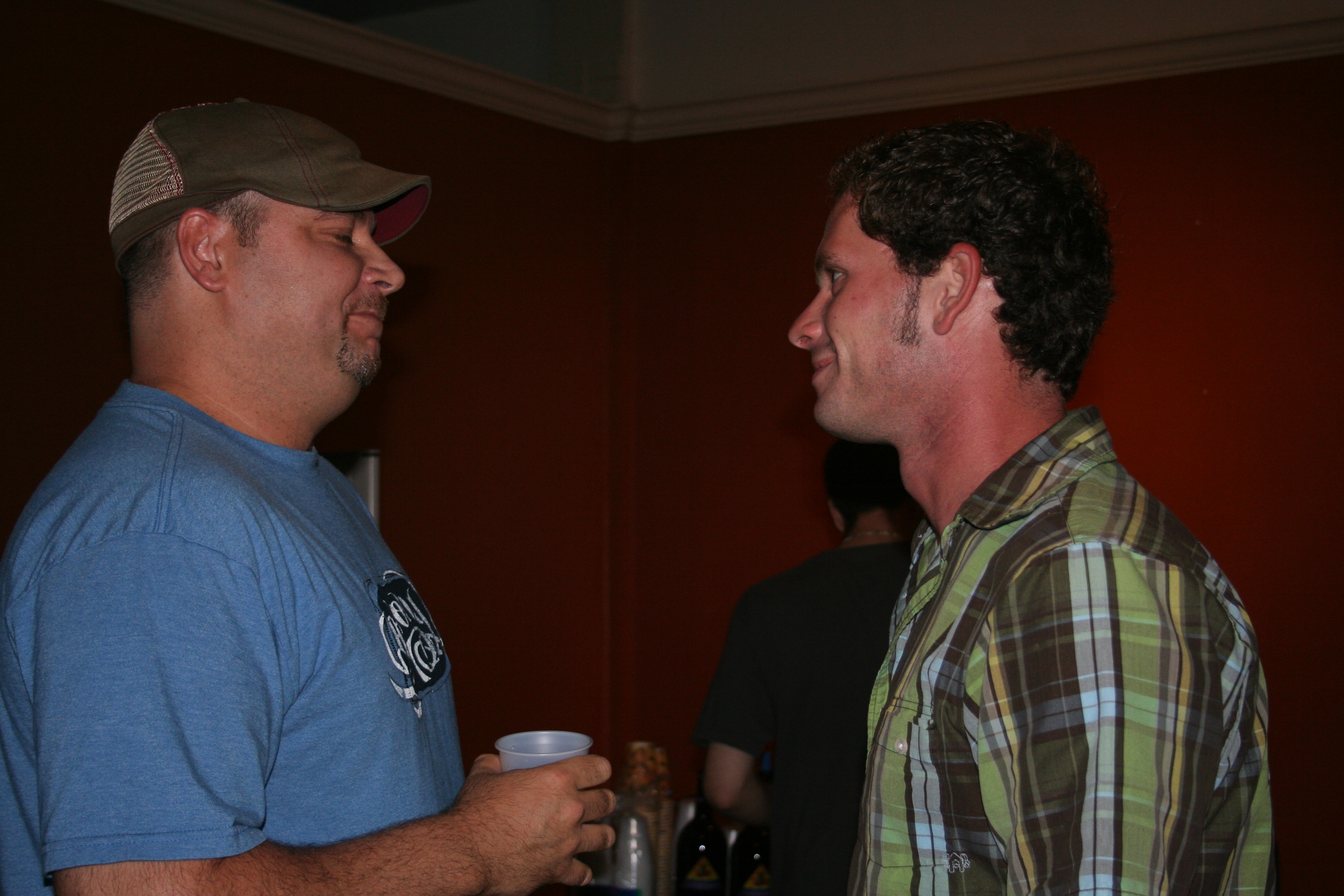 Dave McRoberts visits with a friend at the ArtsScene