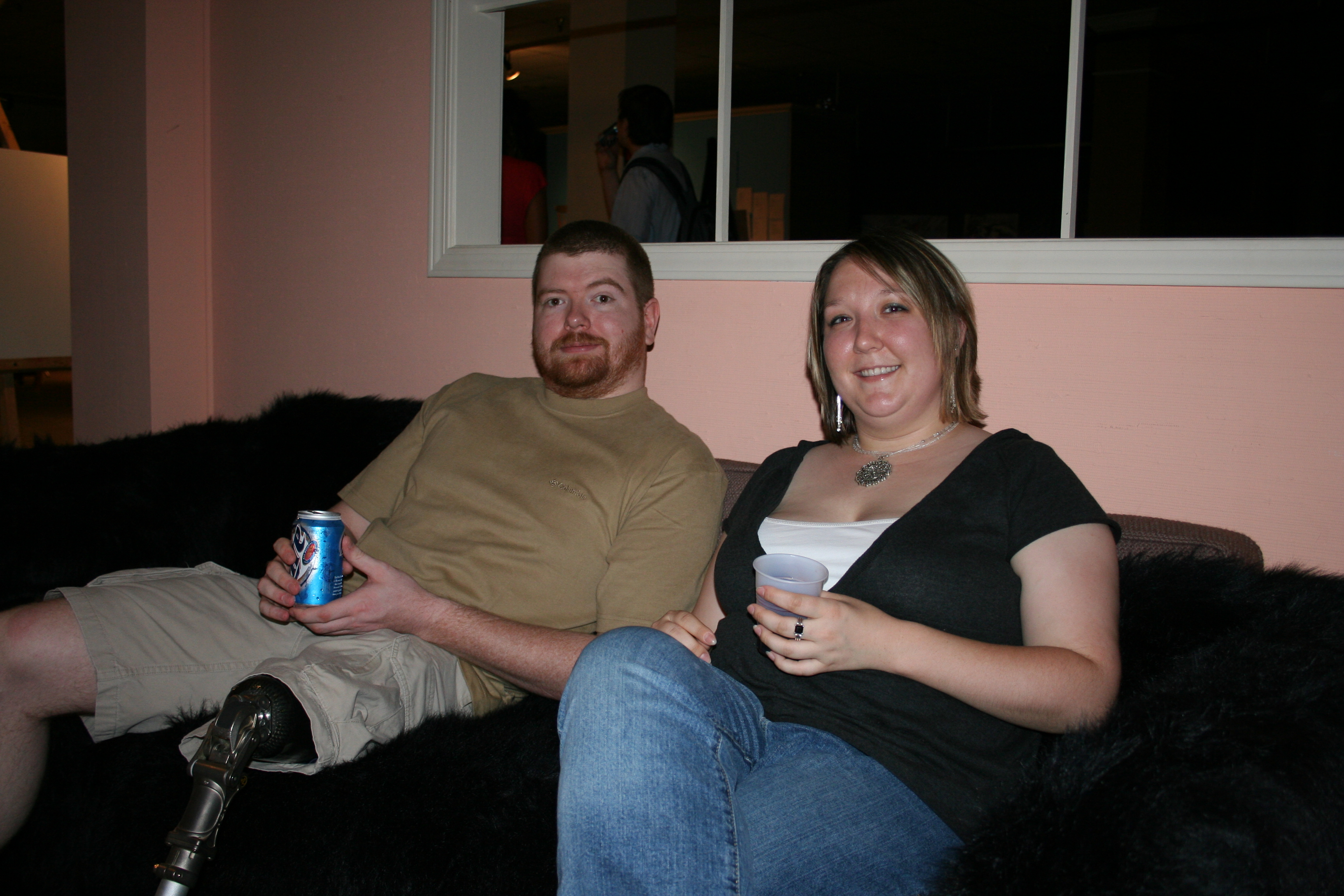 Scott Autry and Amanda Willis grab a drink and sit on the couch to chat
