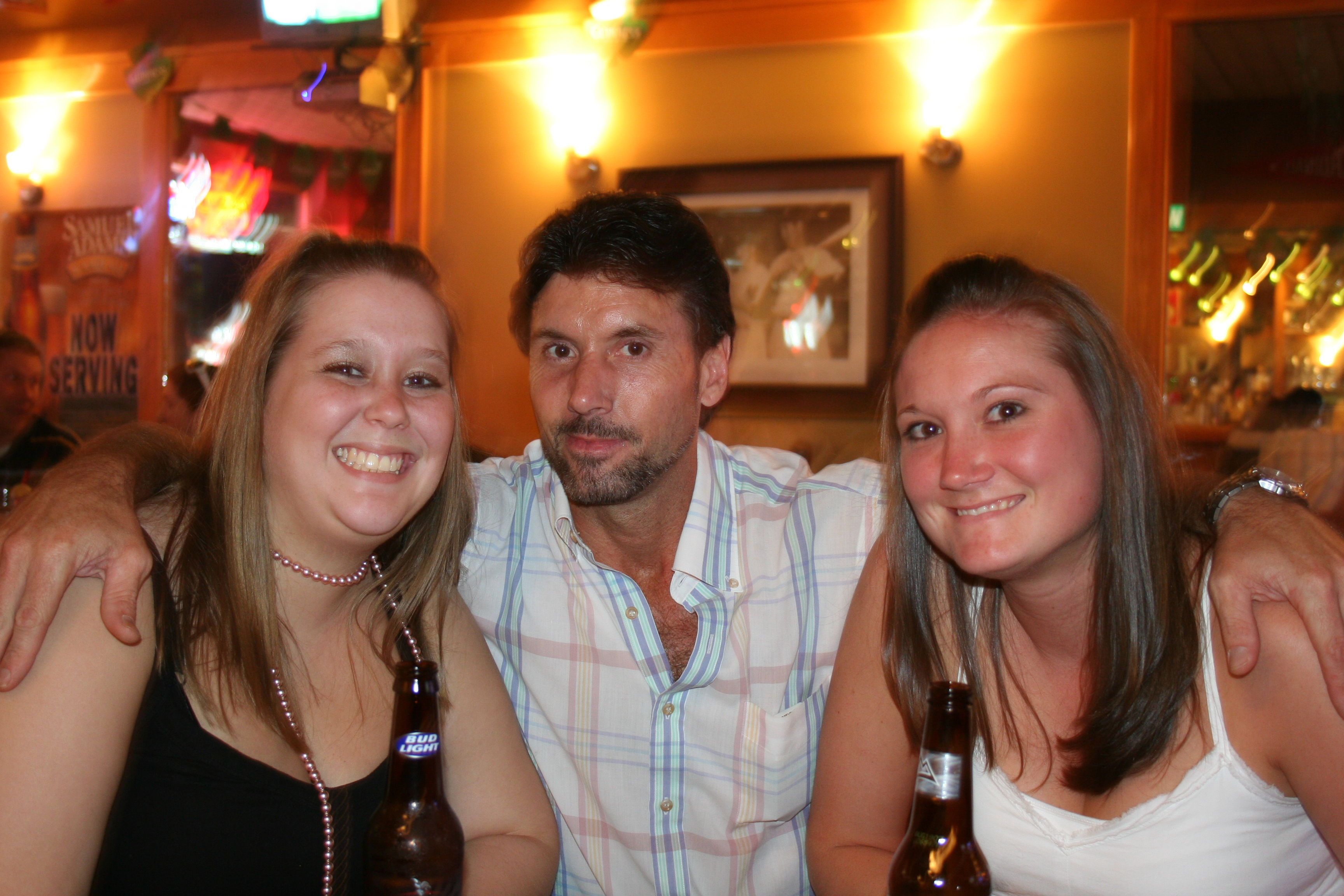 Jennifer Albright and Kristin Pottle get a hug from Kevin Benoit.