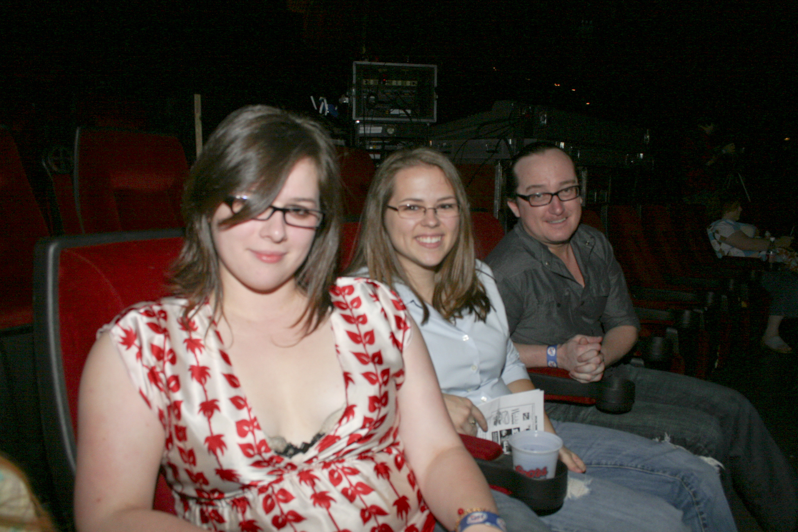 Sarah Snell, Britni Dumas and David Bratton take a breather between comedy acts.