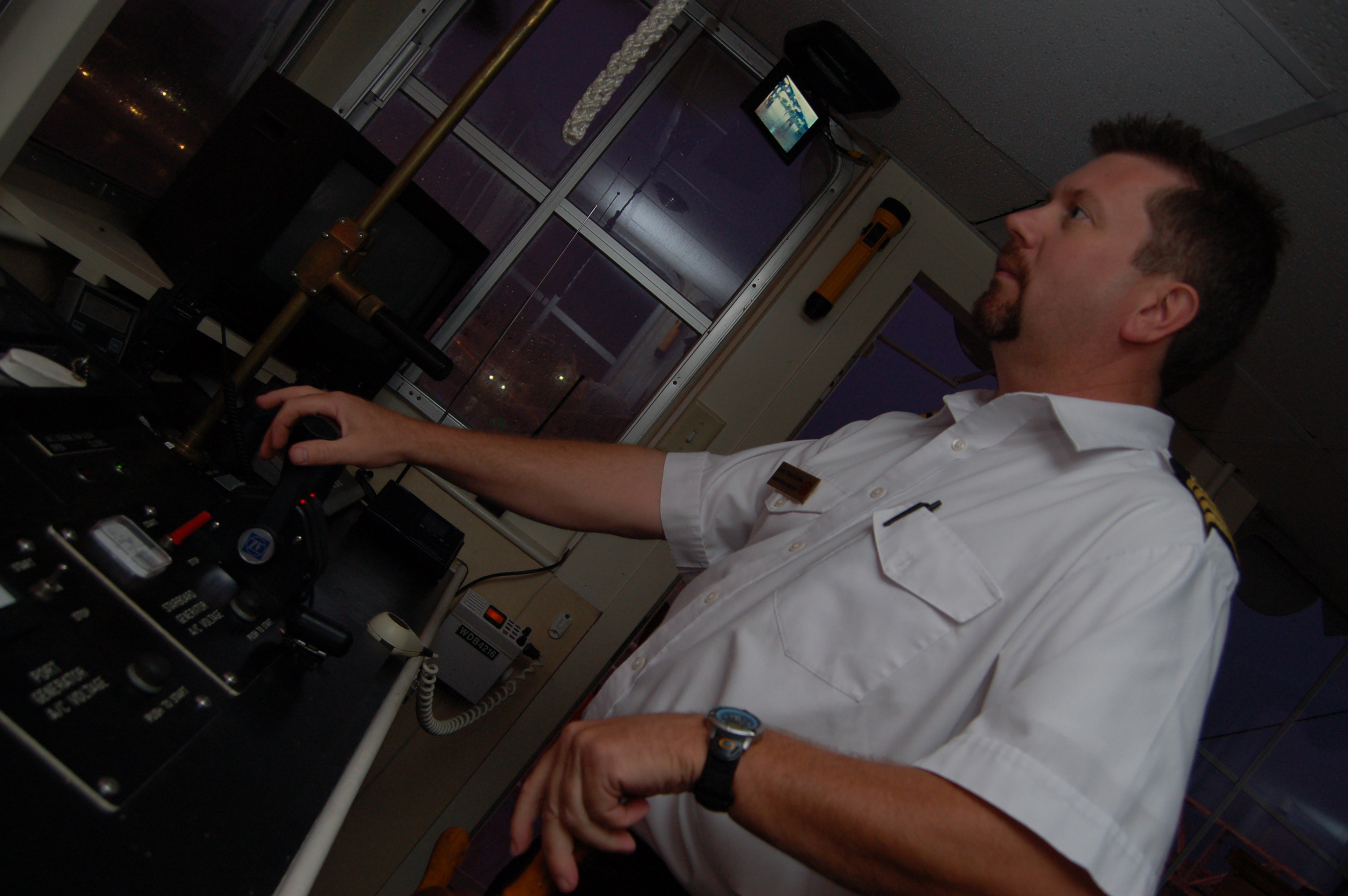 Capt. Mark Hunter mans the Arkansas Queen controls during a recent dinner cruise.