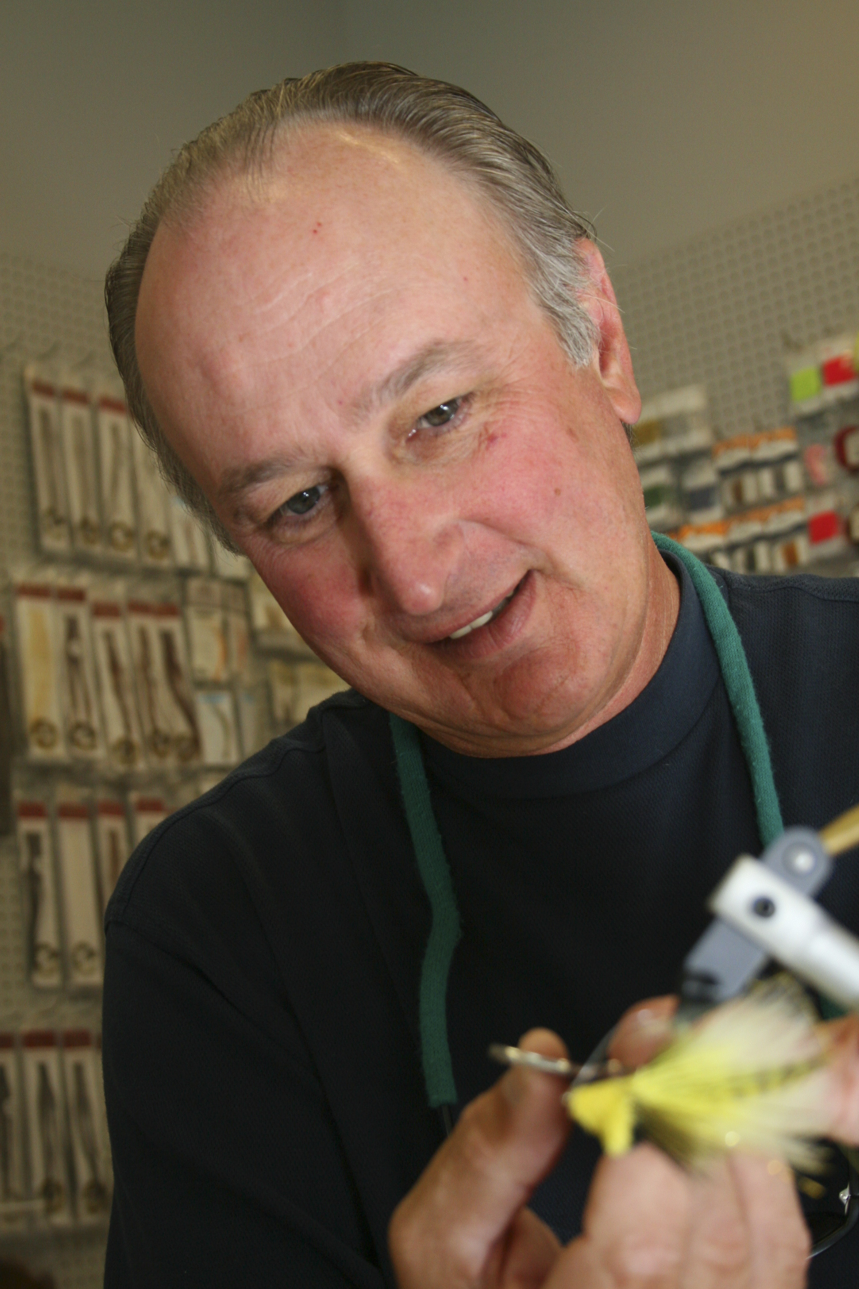 Tom Hawthorne puts the final touches on his fly.