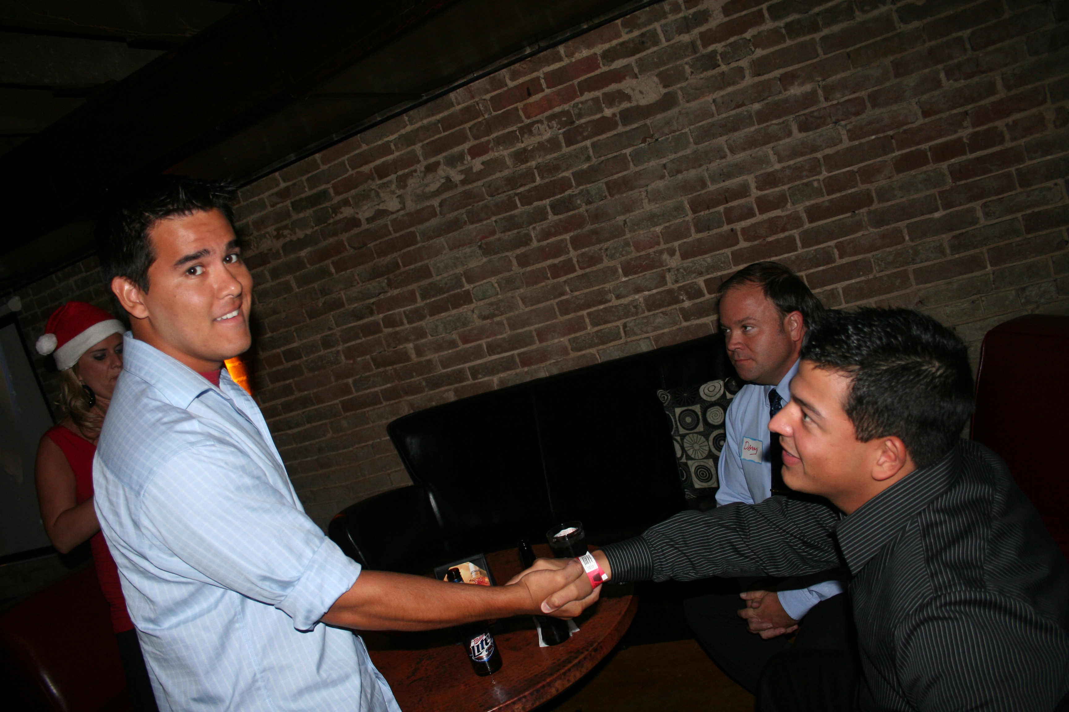 Sam Carrasquillo welcomes Bobby Matthews (standing) to the party.