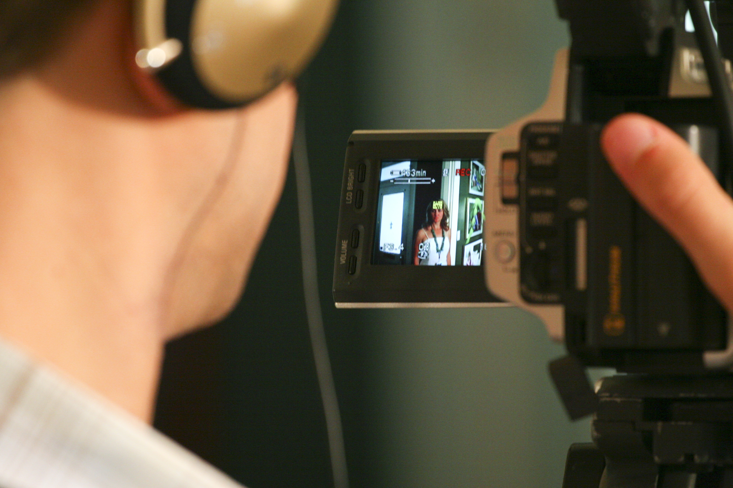 Dean Clift uses the screen on his camera to get the right shot of Mindy Hawes.