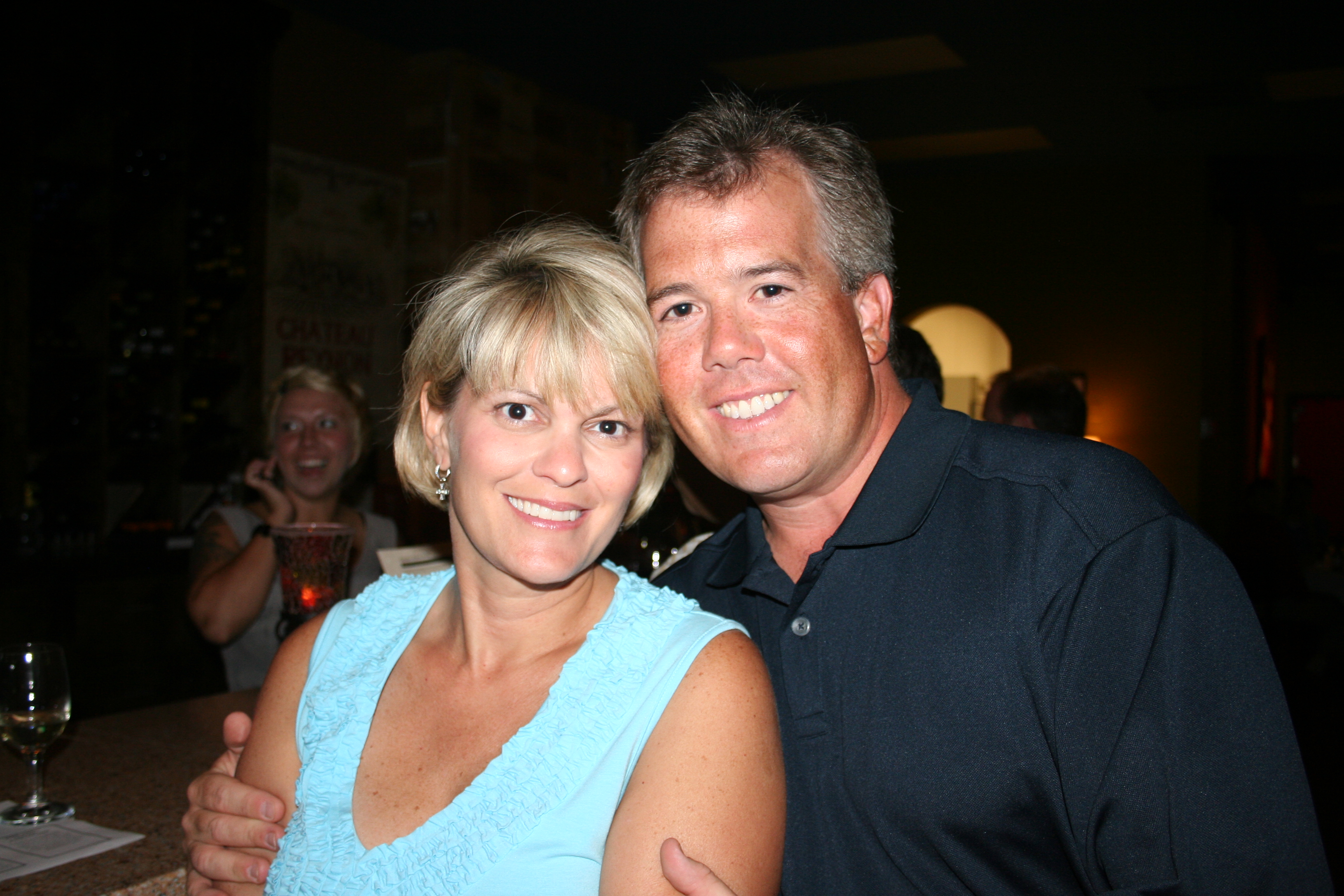 Then the husbands arrive!
Susie and Eric Munson hug and give SYNC a smile.