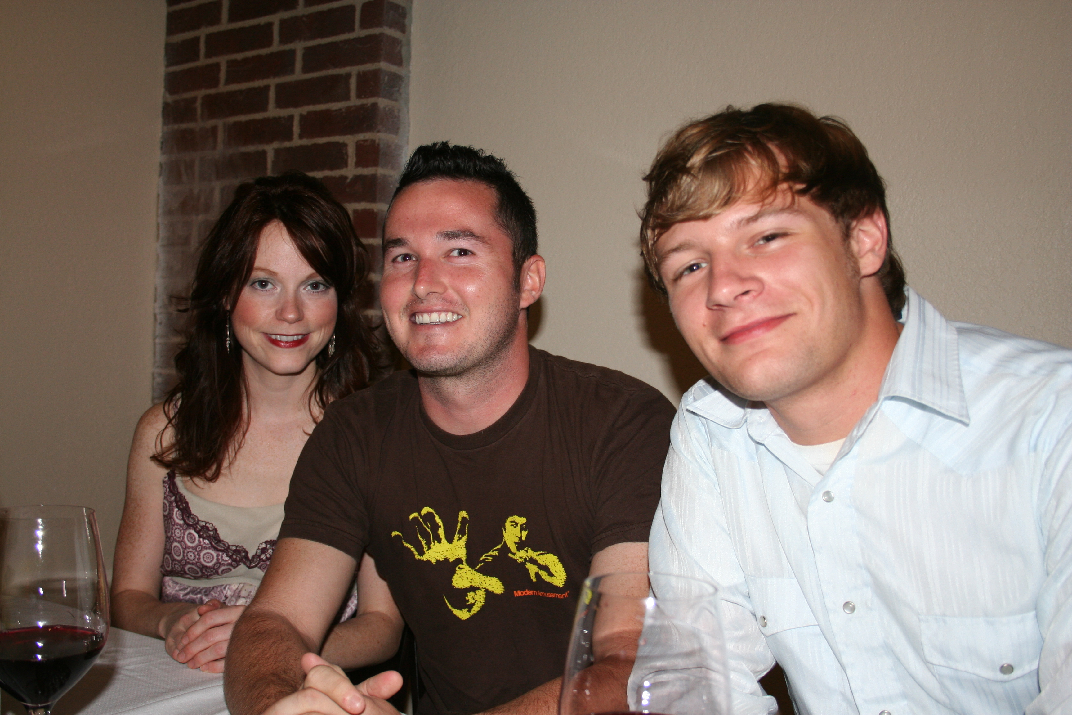 Holly Gilbert, Trent Kelly and Russ Montgomery enjoy a big table full of wine, conversation and friends!