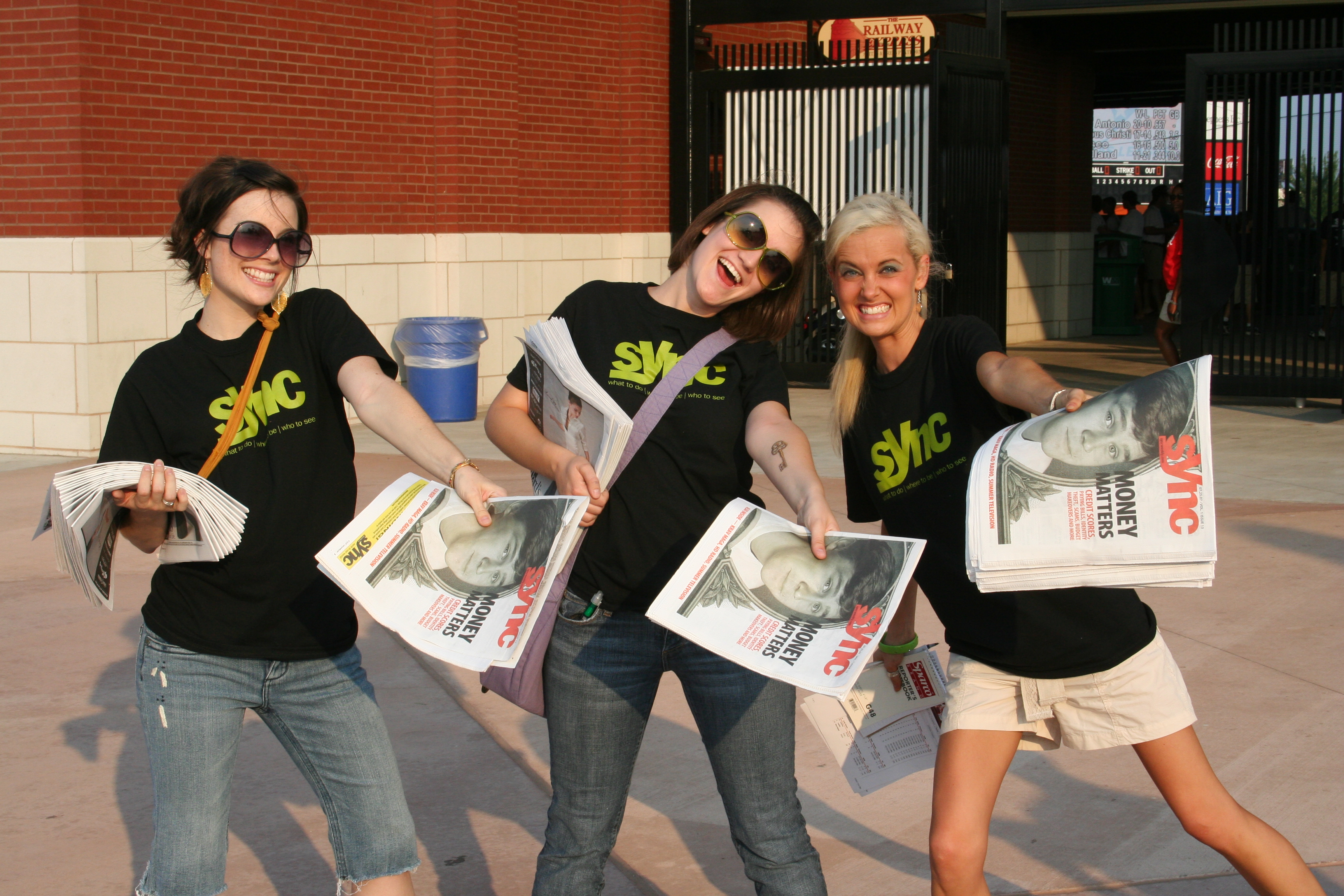 SYNC's Shannon, Elizabeth and Lauren greet the fans with SYNC papers.