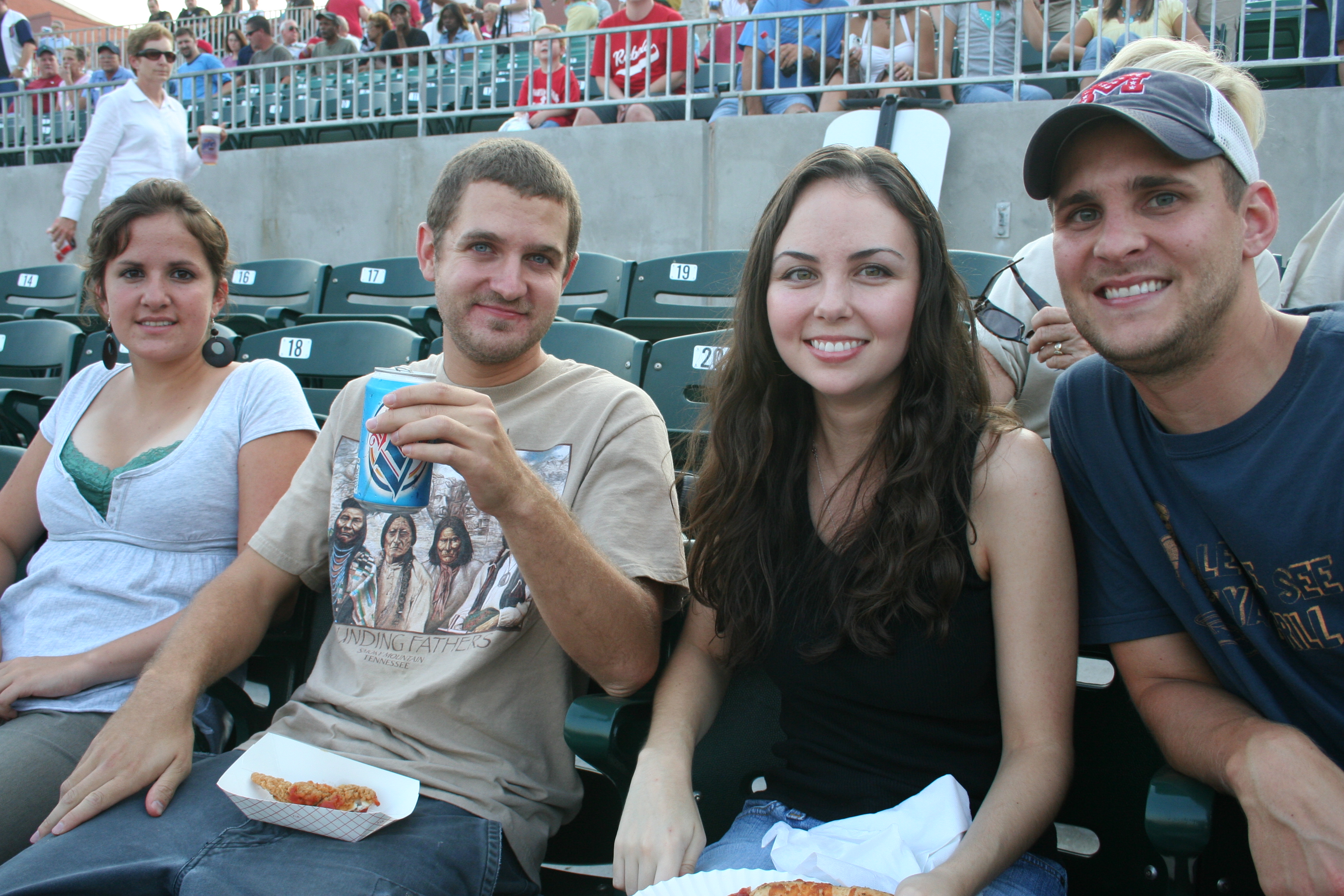 Noemie Fornier, Matt Dayer, Sarah Beth Dayer and Matt Hancock enjoy a seat close to 1st base.