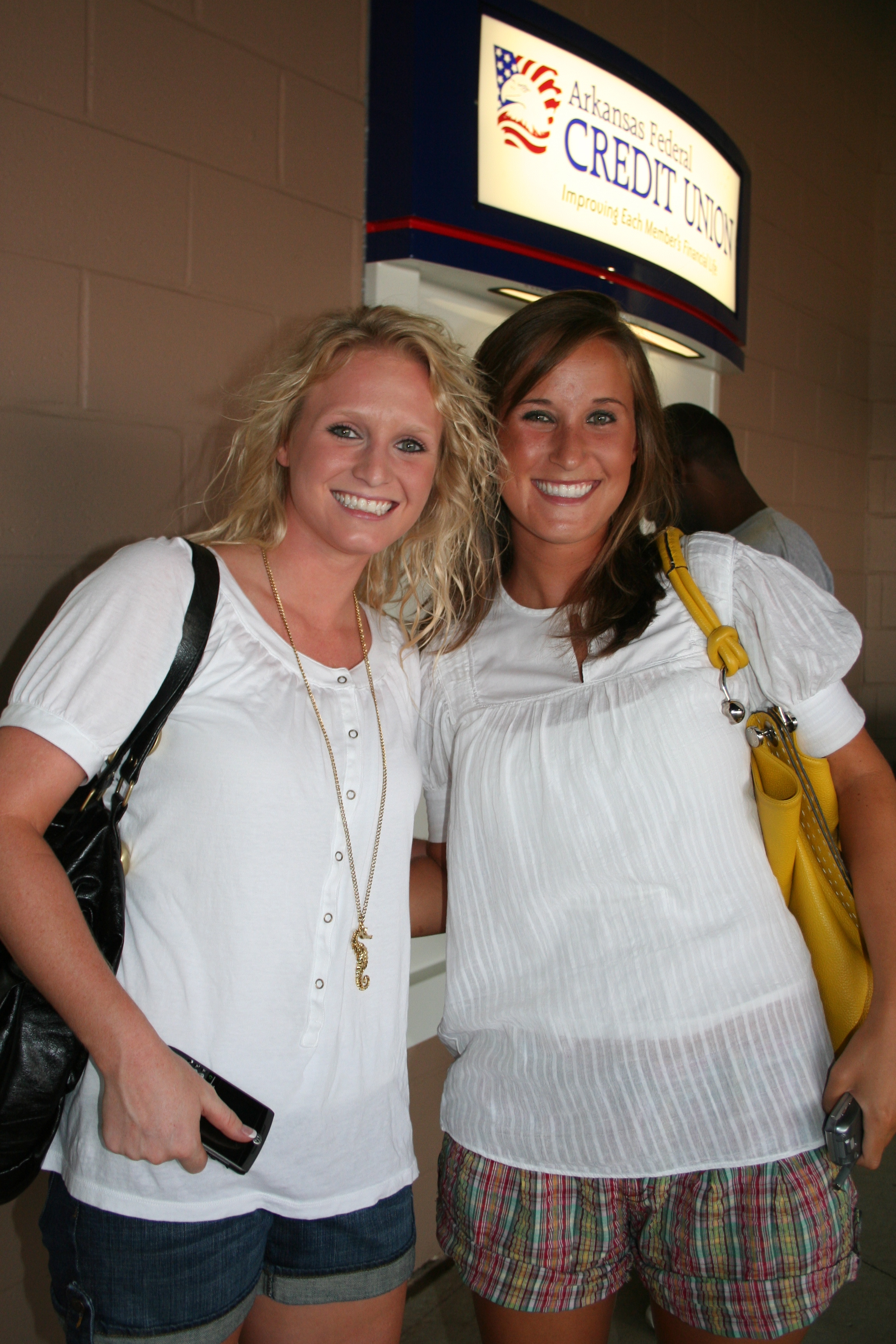 Lauren Collins and Maeve Andrews visit the ATM so they can enjoy the concessions!