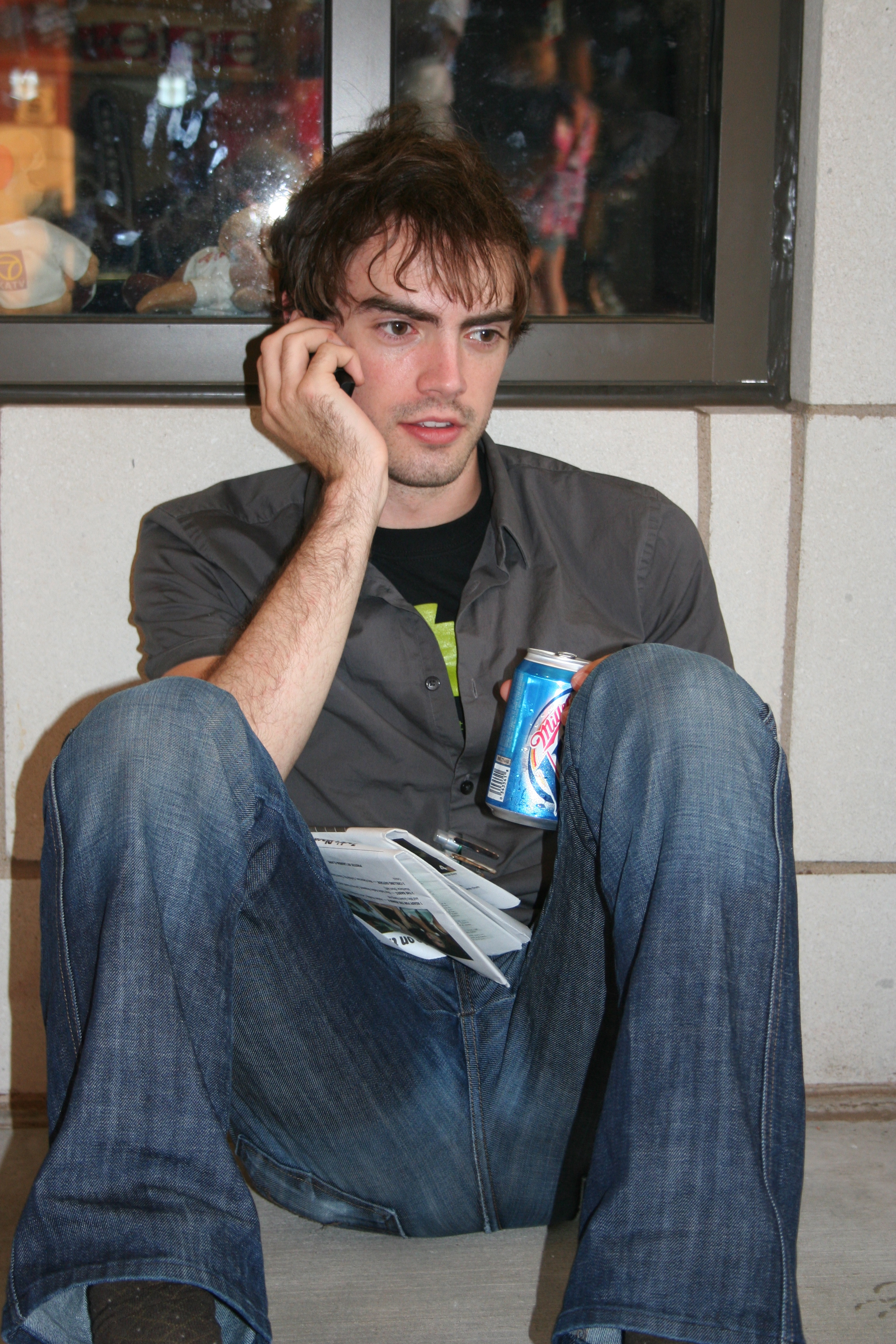 James takes a break from the heat to get a cool beverage and make a call.