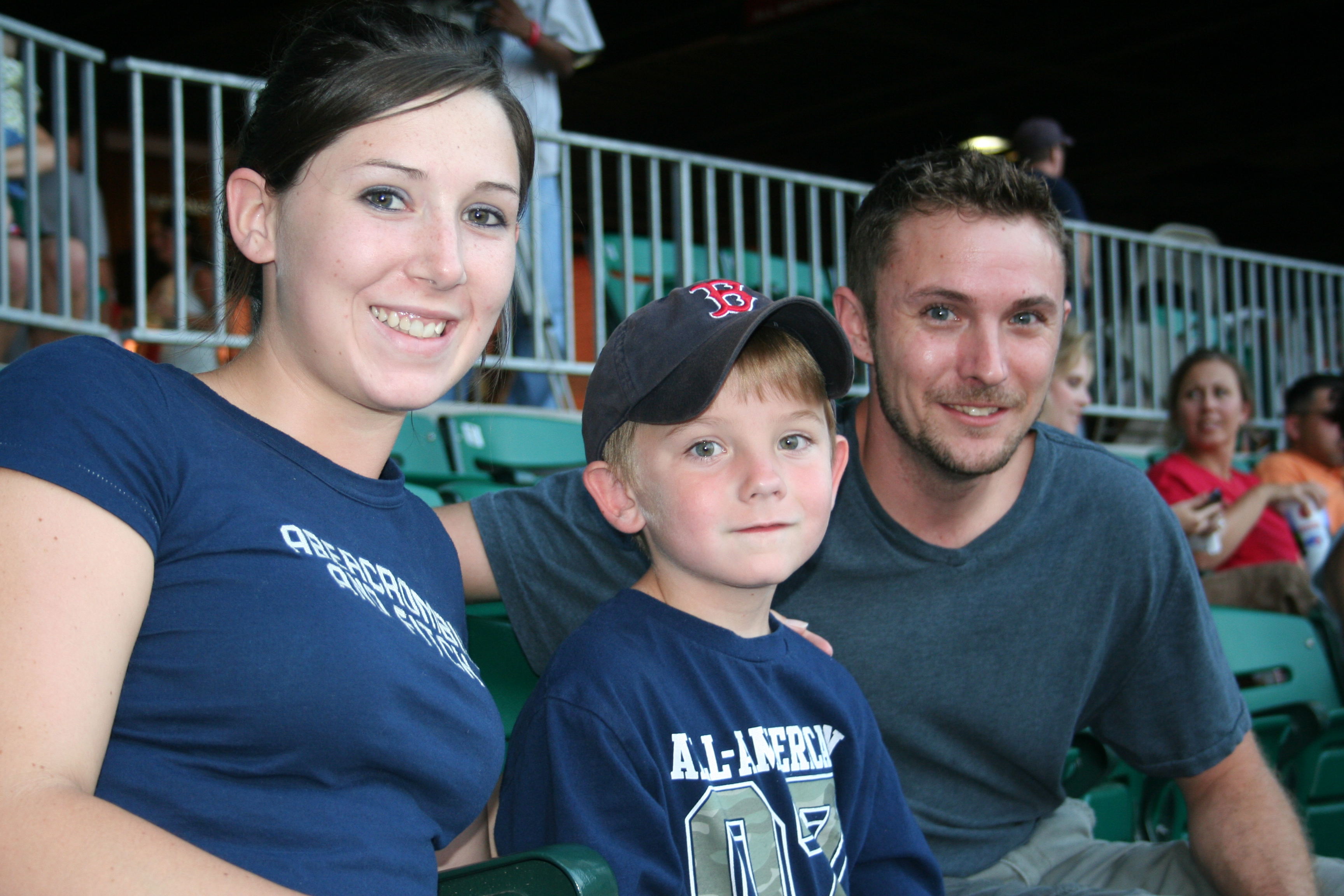 Brittany Martin, Avery Robbins and Michael Robbins enjoy the game.