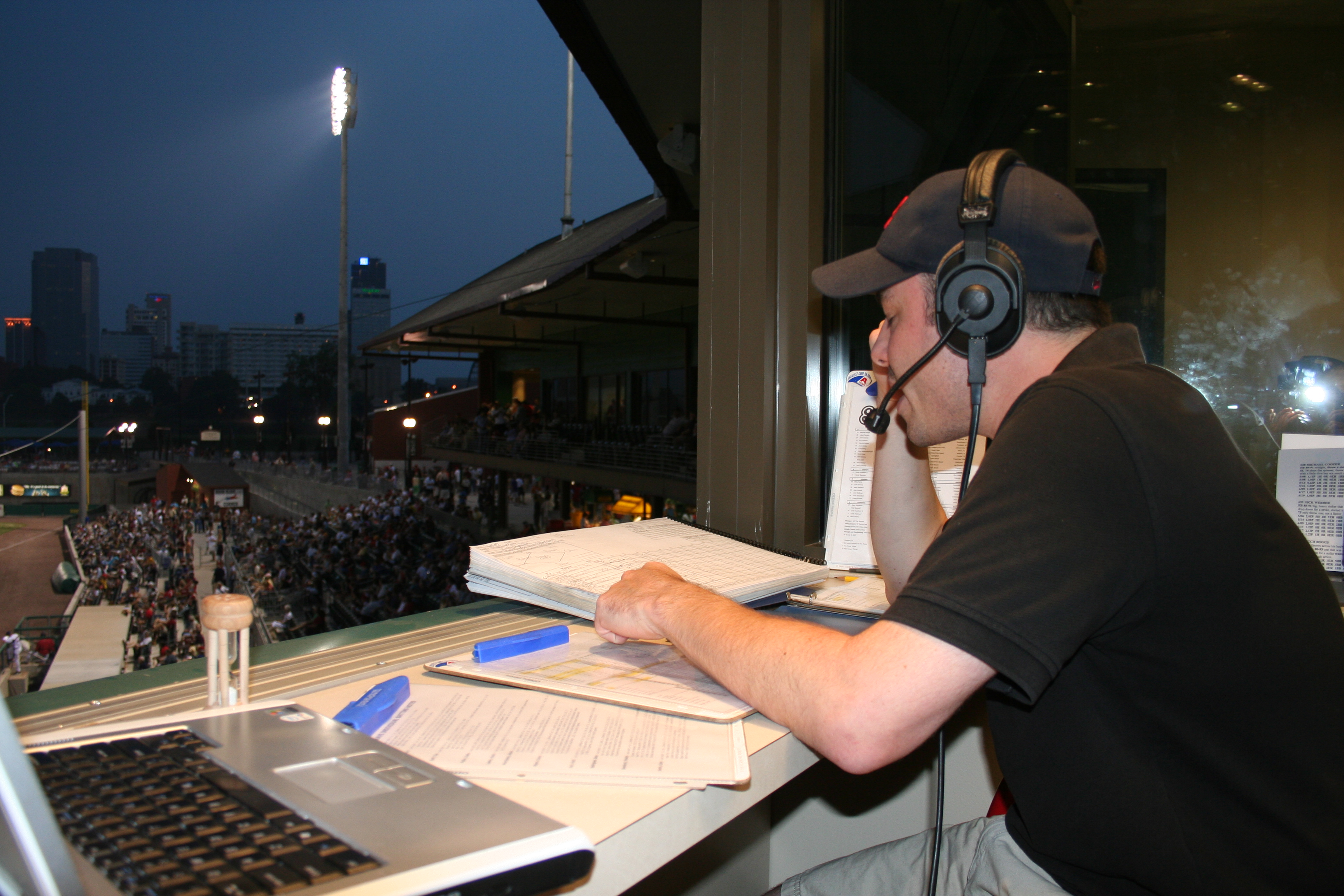 Phil Elson, the Travs' radio broadcaster, does his thing in the pressbox.