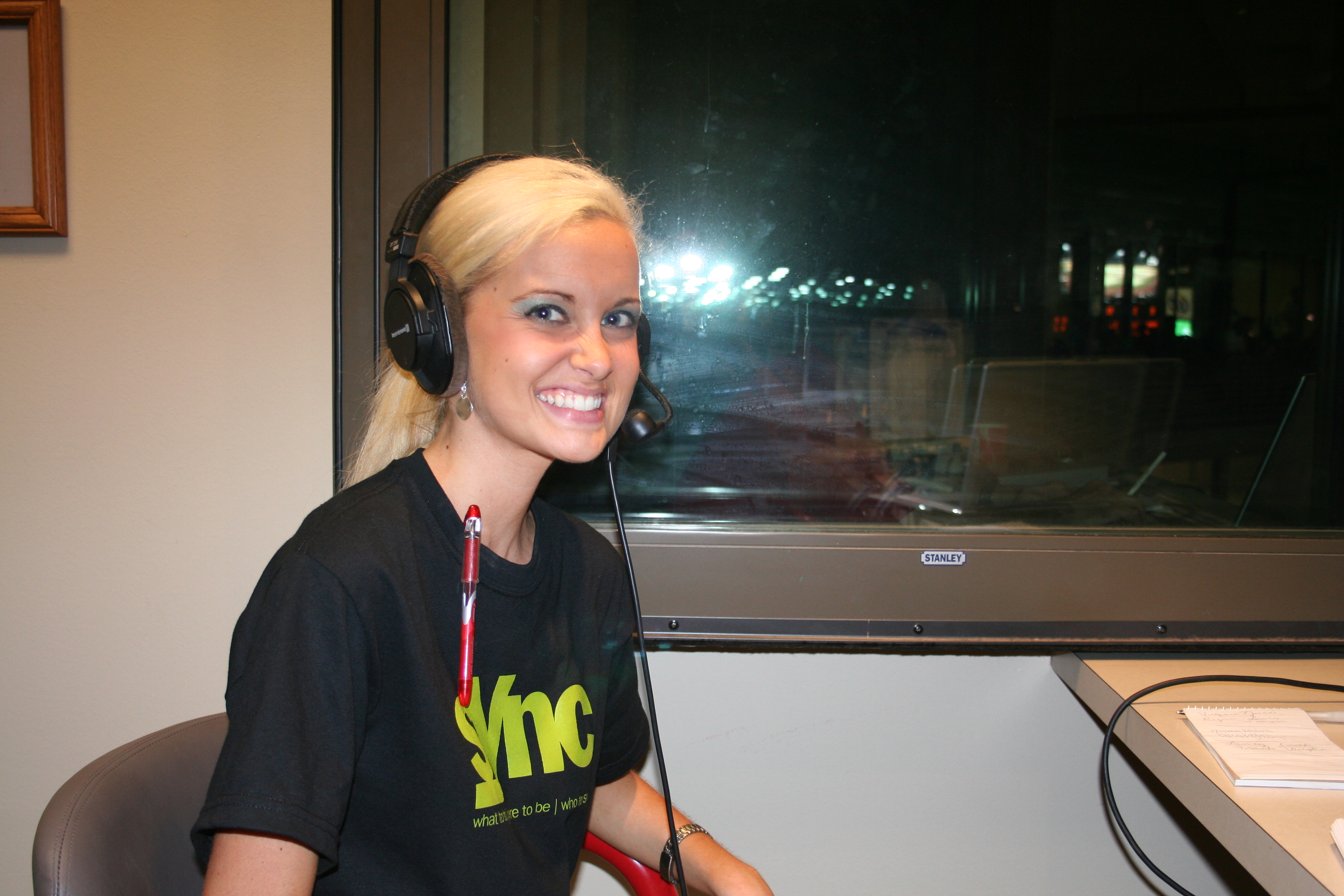 then, SYNC's Lauren smiles for the camera as she chats with Phil on the radio broadcast.