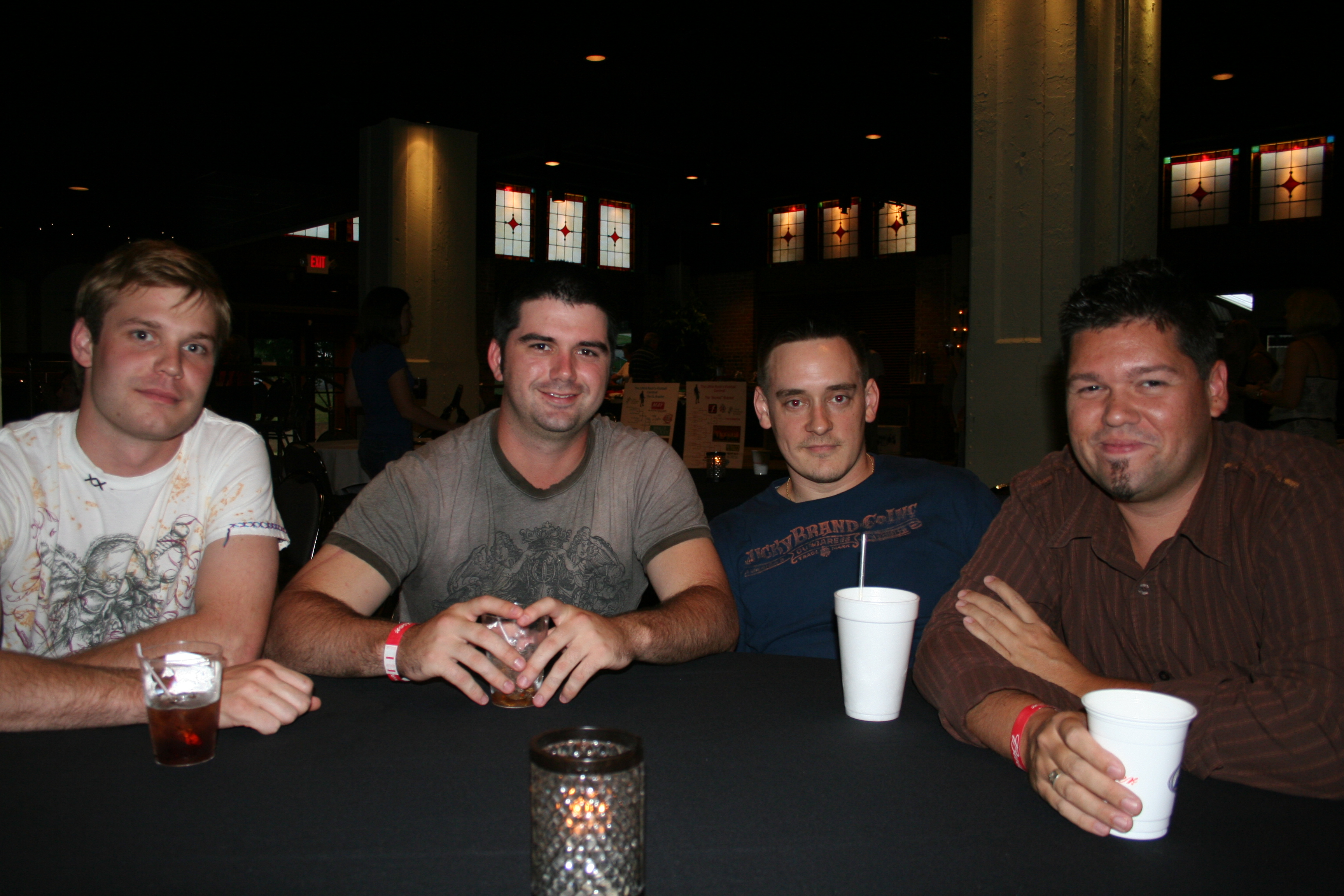 Tyler Runnels, Will Haupt, Robert Williamson and Javan Coombs visit at the Kickball Tournament Kickoff Party.