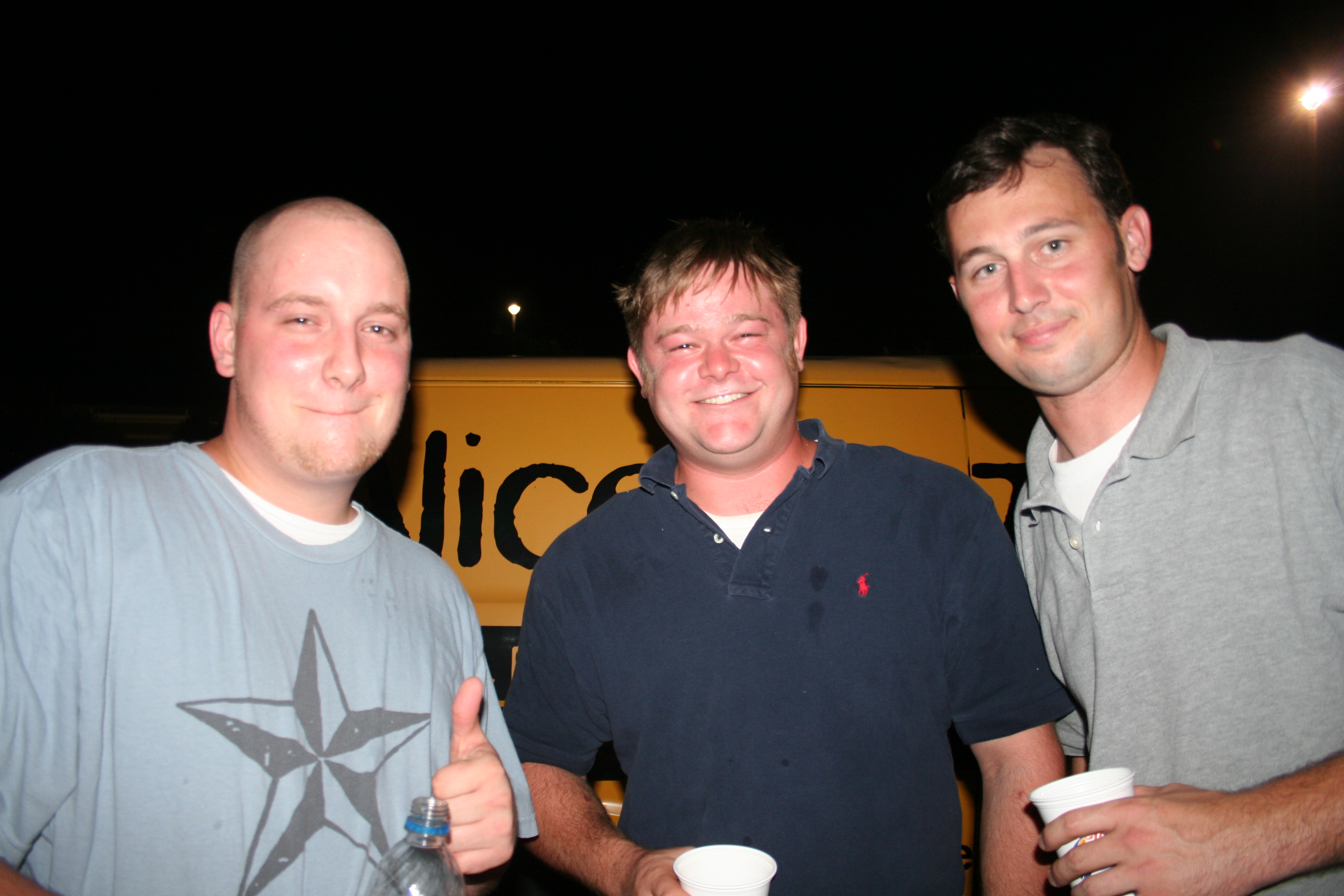 Mike Williams, Thomas George and Nathan Kovaleski enjoy the outdoor scene at Beef O' Brady's anniversary party.