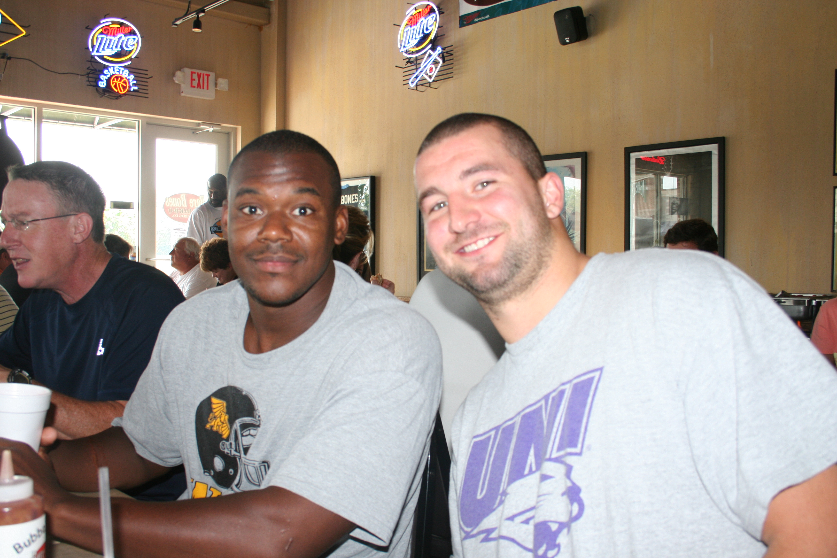 Scorpio Horn and Tanner Varner chow down at BareBones BBQ.