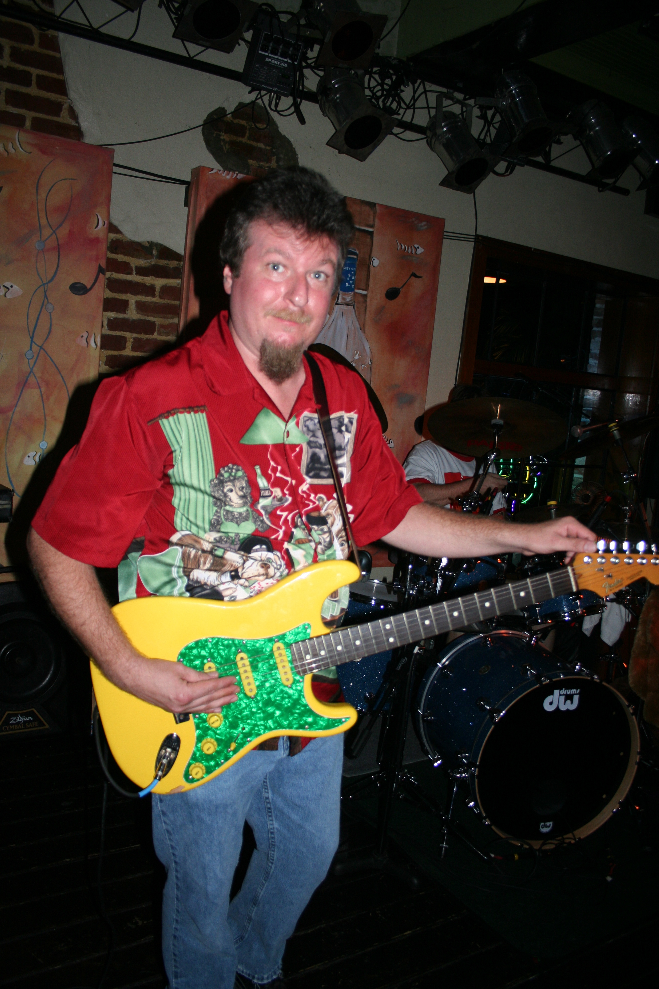 Guitar player for Mr. Happy gets ready to perform