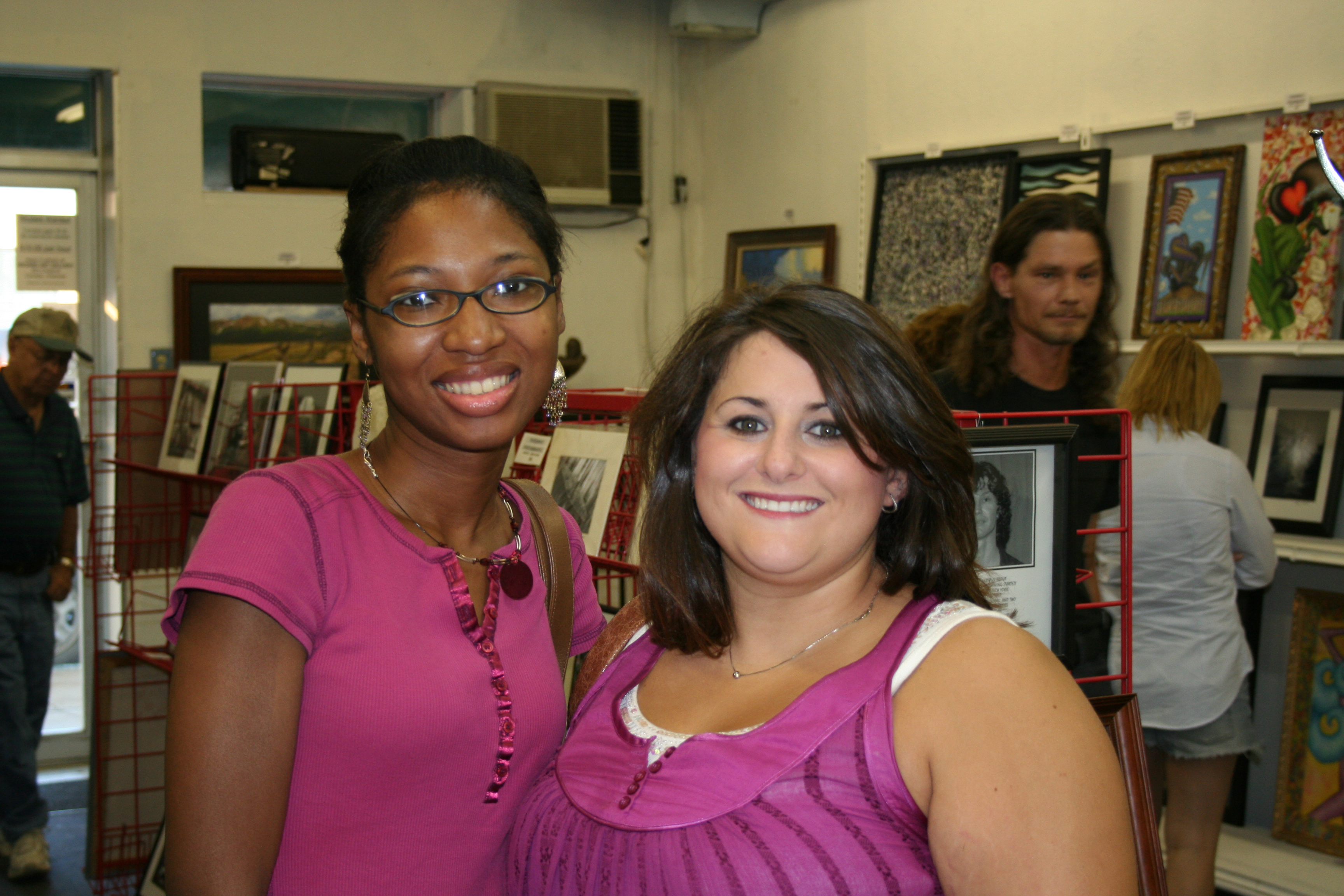 Whitni White and artist Meredith Floyd have a good time at "Art After Hours" at Riciano Art Gallery in Conway.