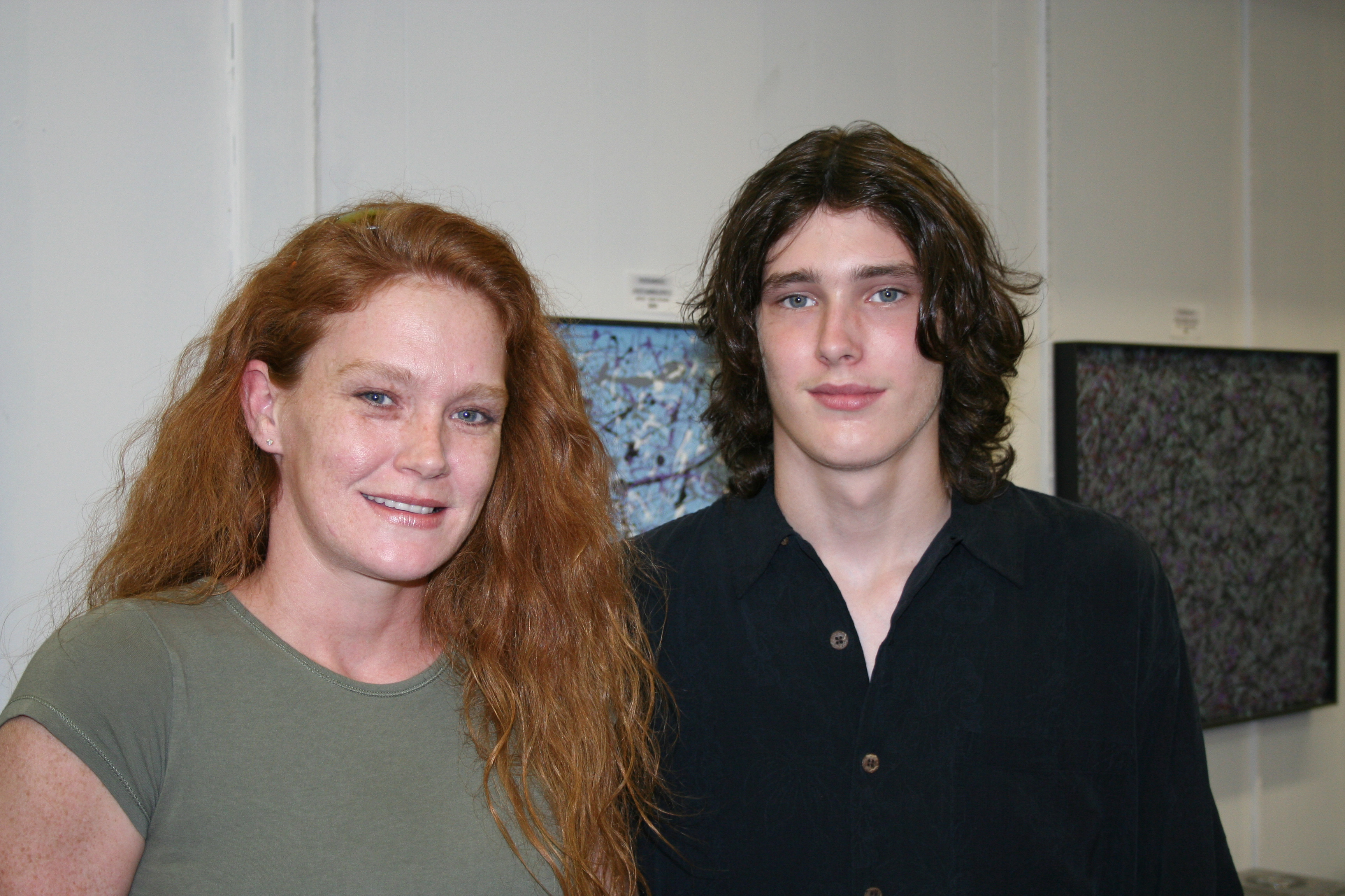 Danae Rice, pictured with her son Dylan, supports her brother, Terry Riciano, during "Art After Hours" on Saturday at the Riciano Art Gallery in Conway.