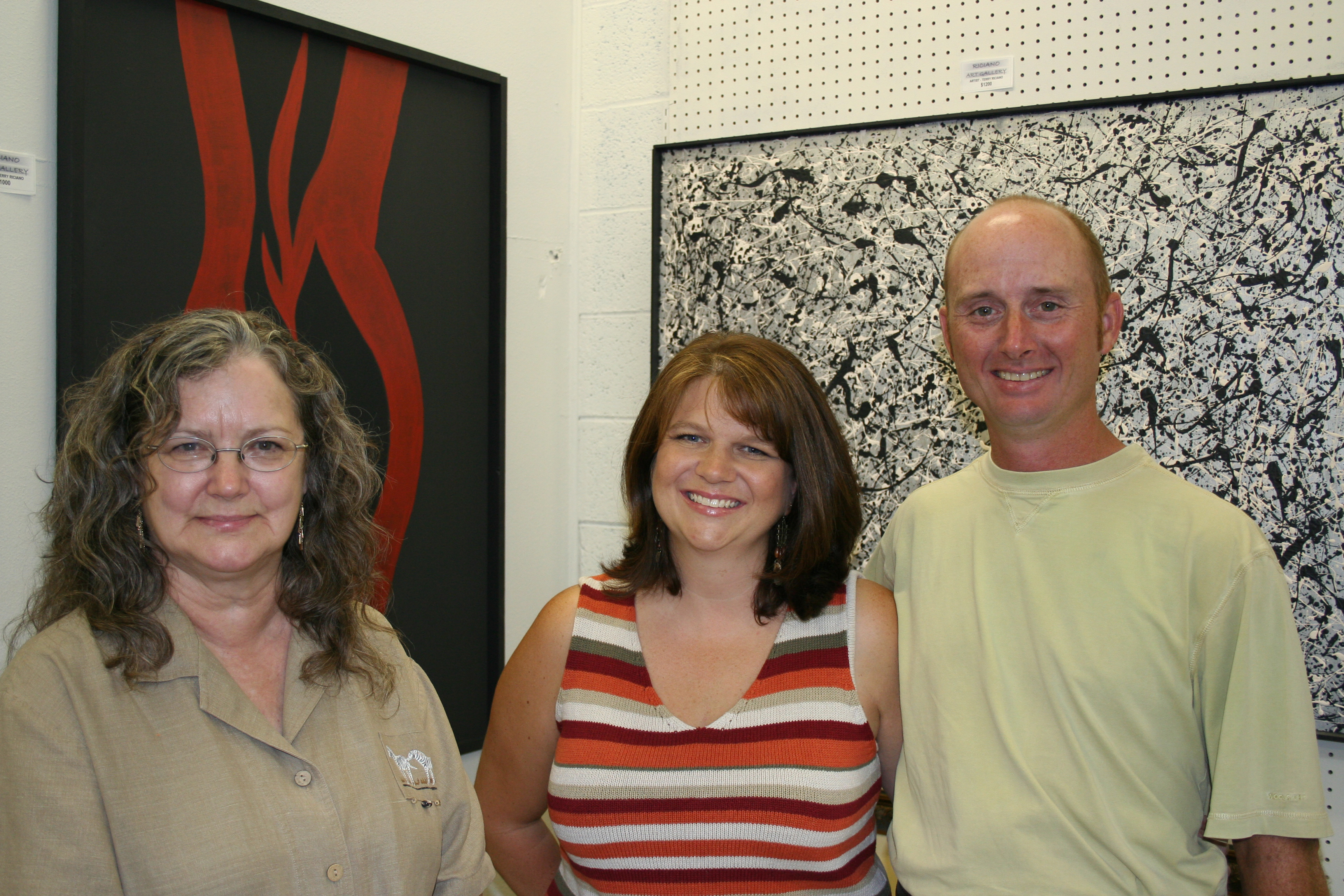 Annette Rice of Quitman and Jill and Kevin Brazil of Benton enjoy "Art After Hours" at Riciano Art Gallery in Conway.
