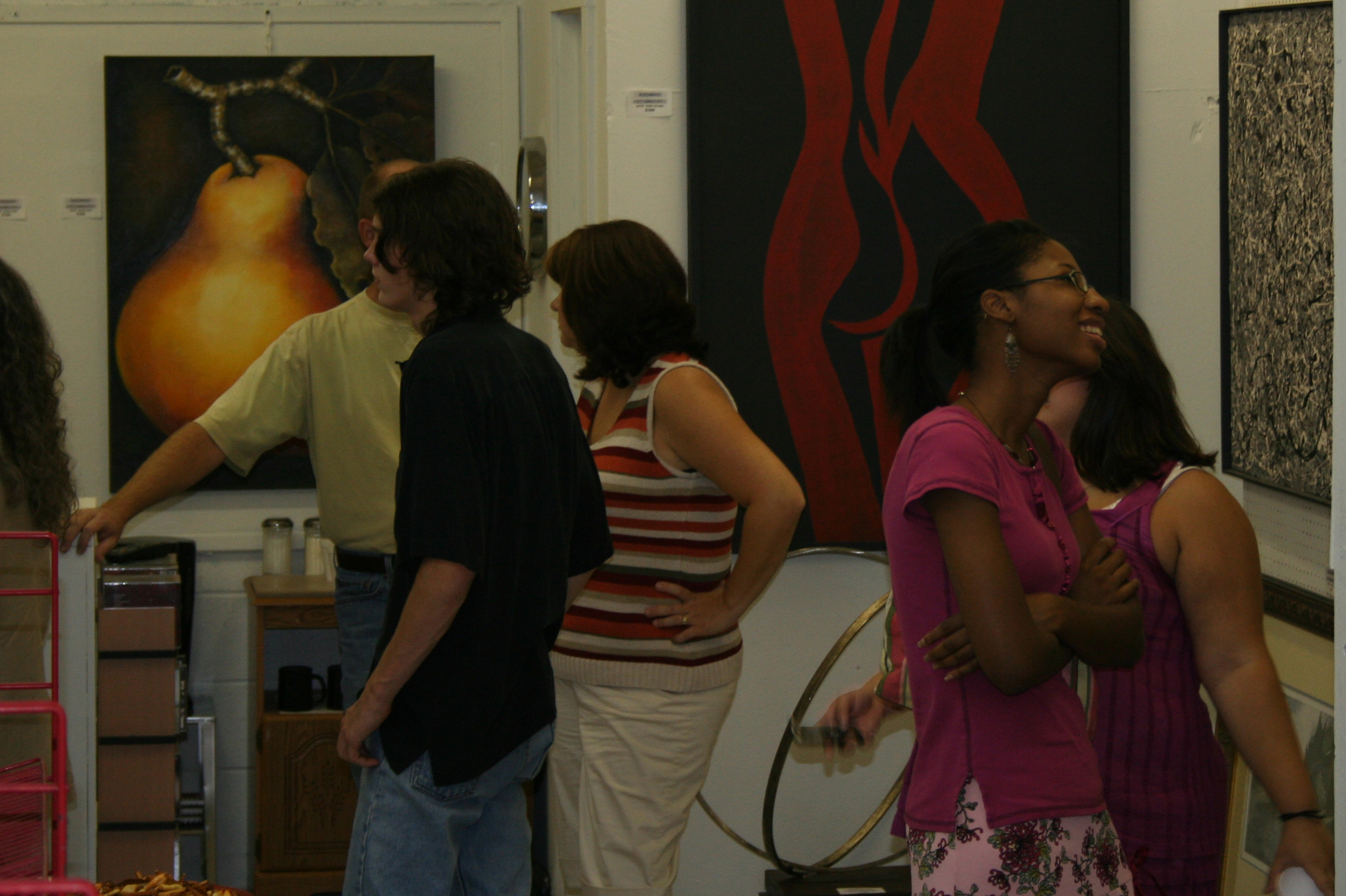 Those who attended "Art After Hours" on Saturday at Riciano Art Gallery in Conway check out all the artwork on display.