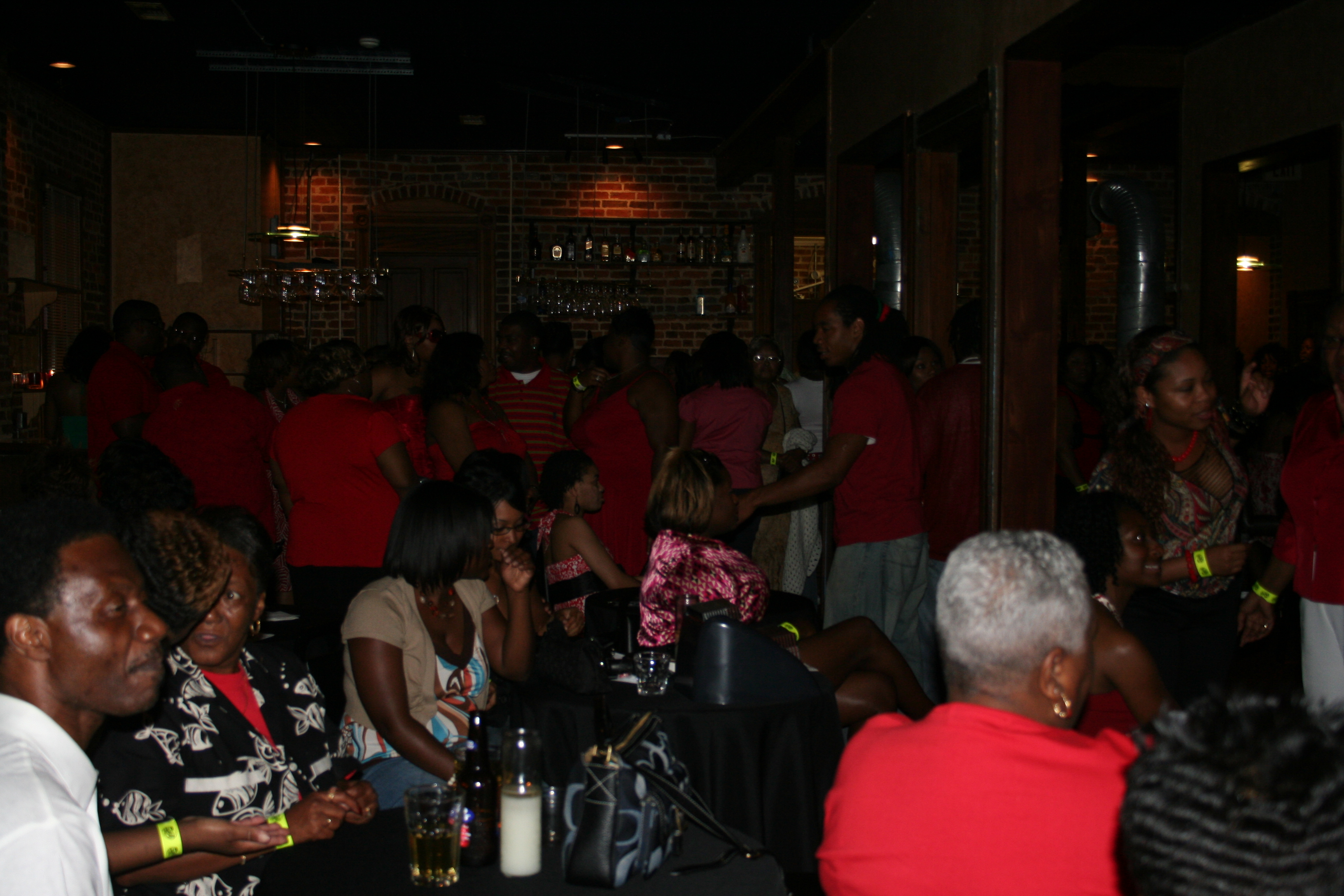 Many party-goers enjoy the Red Party, Friday night.