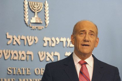 In this photo released by the Government Press Office, Israeli Prime Minister Ehud Olmert, speaks at a press conference eat his Jerusalem office, Monday.