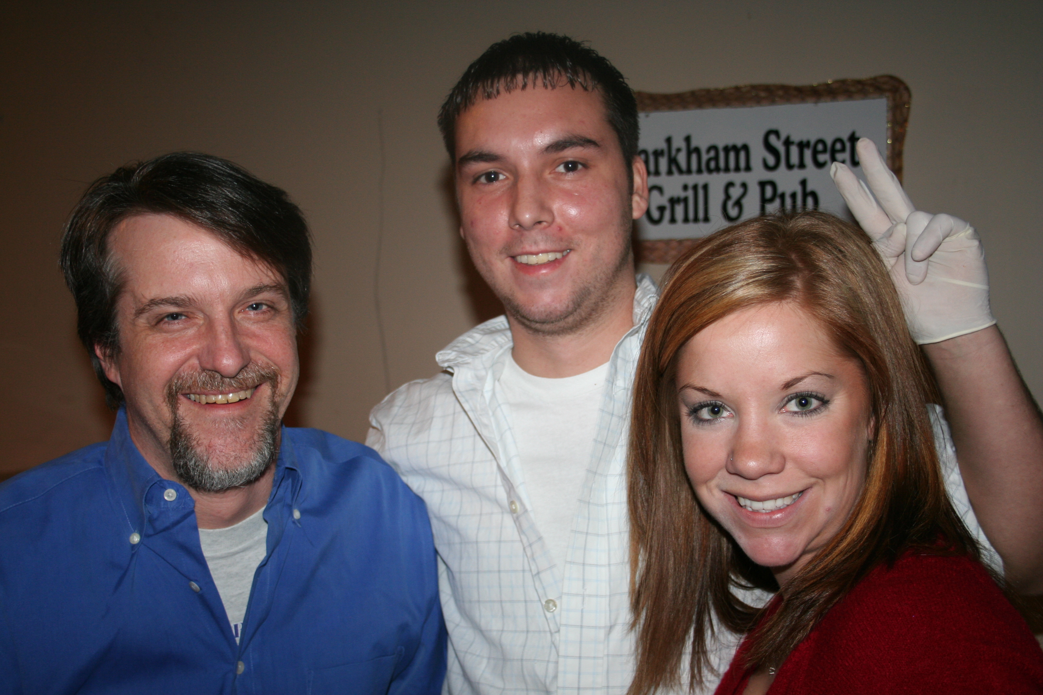 Don, Patrick and Angela serve crawfish cakes from Markham St. Pub.