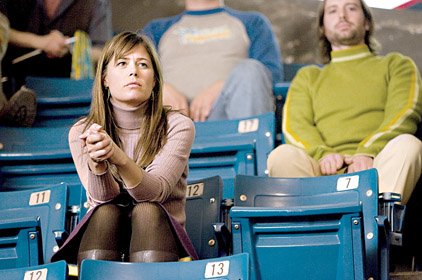 Lynn (Maura Tierney) is a fan of the Flint Tropics basketball team in Semi-Pro.