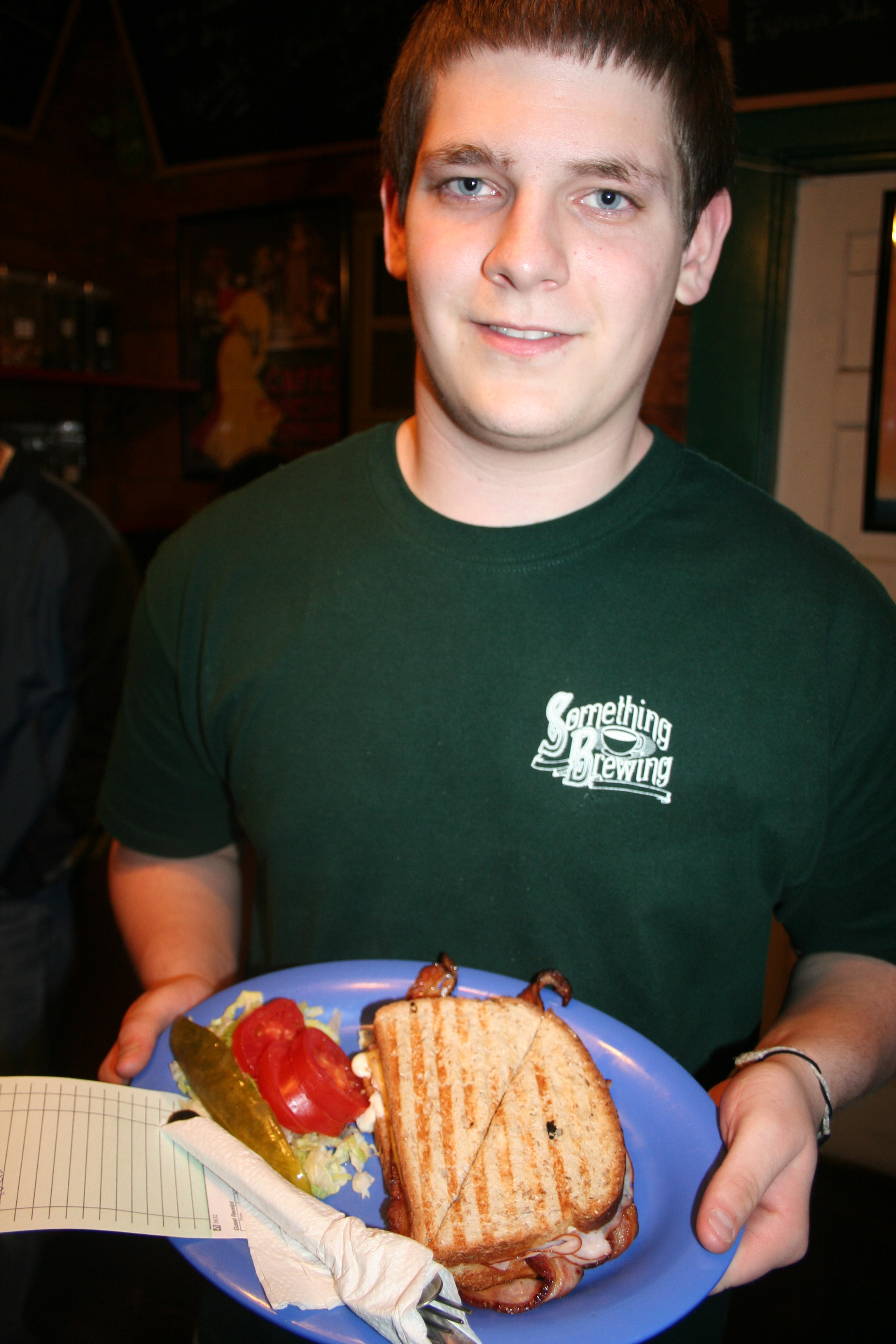 Matt Morgan serves a club sandwich.