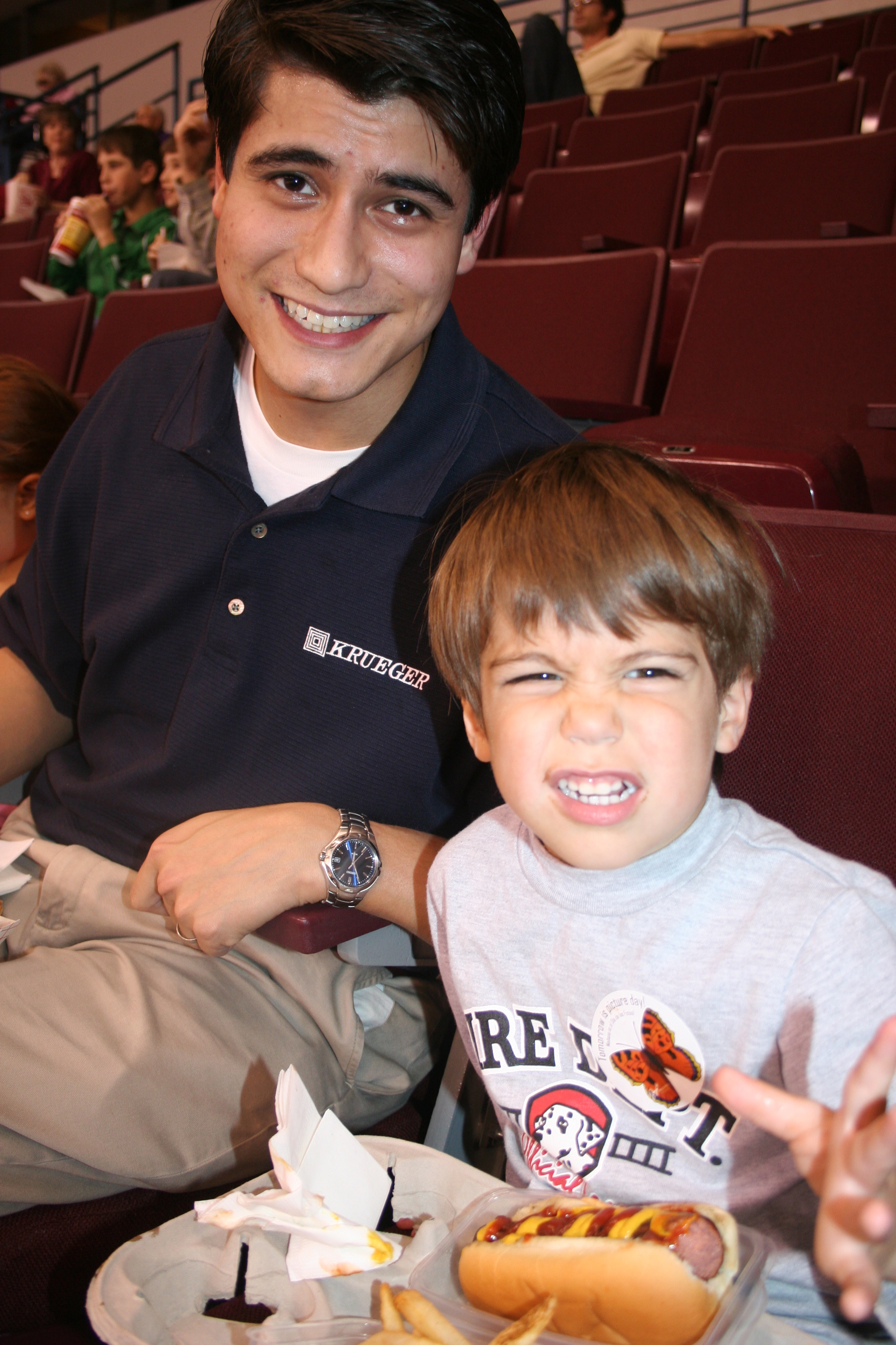 Rich and Connor Walters enjoy ballgame hotdogs.