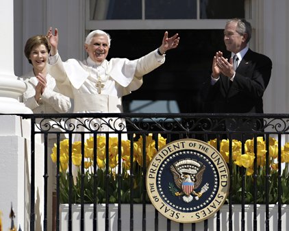 President Bush and first lady Laura Bush flank Pope Benedict XVI as he waves to the crowd from the balcony of the White House in Washington, Wednesday, during an arrival ceremony. 