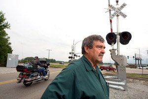 Over the years, Duane Harvey has seen many train-vehicle crashes at the railroad crossing across from his motorcycle shop north of Jonesboro, where crossing arms and timed stoplights were recently installed.