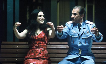 Egyptian police officer Tawfiq (Sasson Gabai) lightens up with Israeli
Dina (Ronit Elkabetz) in The Band's Visit.