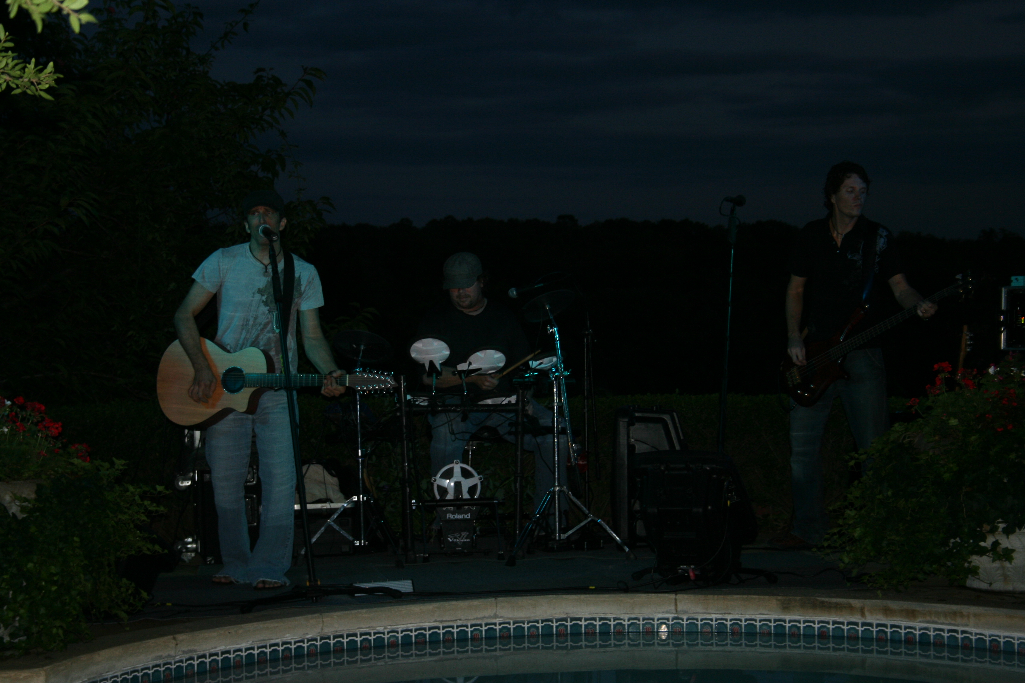 24. Tragikly White performs by the pool.
