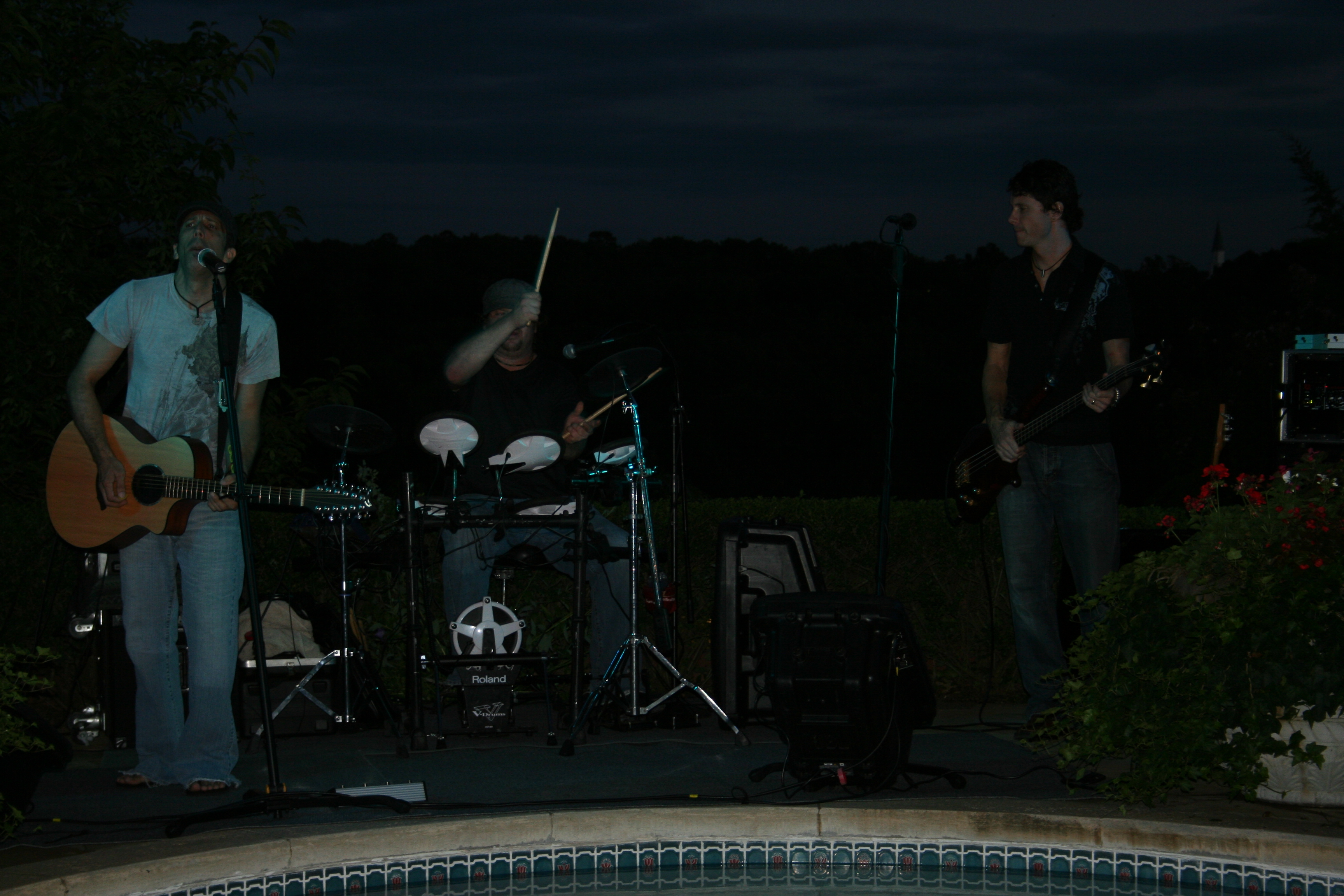 25. Tragikly White performs by the pool.