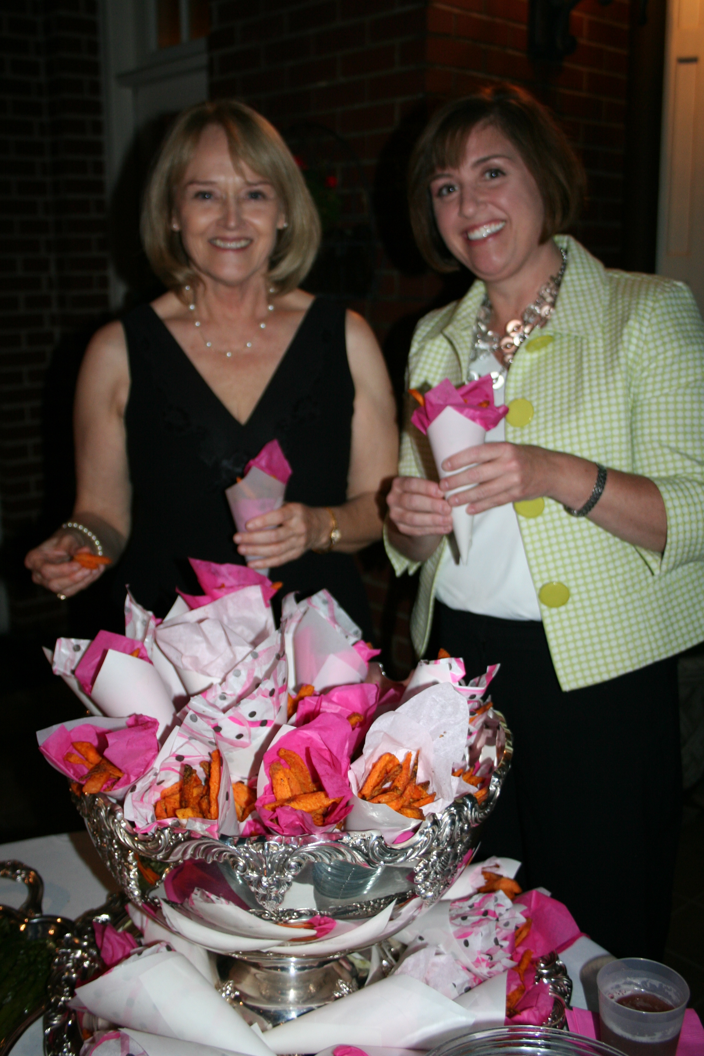 28. Sherry McBryde and Amy Treadway taste the tidbits.