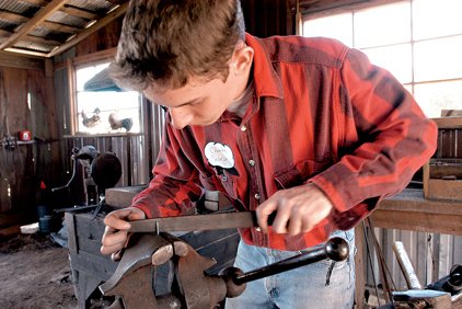 Charlie Casey from Beebe files down and sharpens the point of a turning fork he forged out of wrought iron in the blacksmith shop during the Scott Plantation
Settlement's High Cotton on the
Bayou event in this 2006 file photo. 