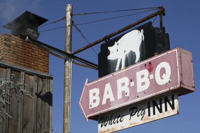 FILE - The White Pig Inn serves up the hickory-smoked classics in North Little Rock.