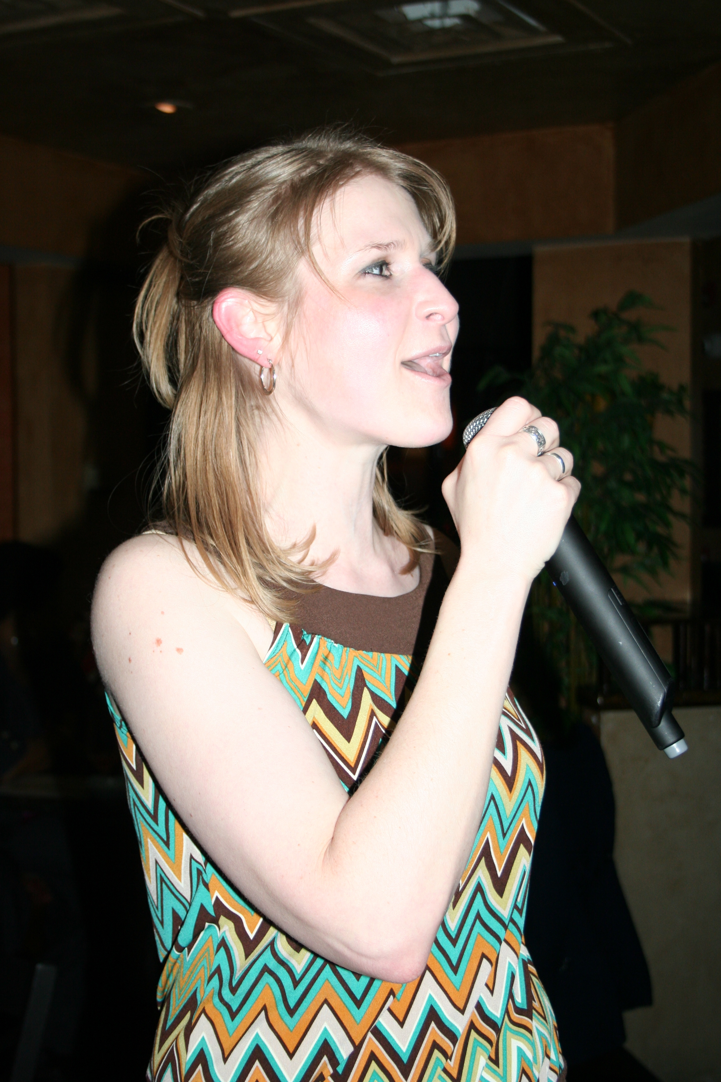 Singing a birthday song to her friend
