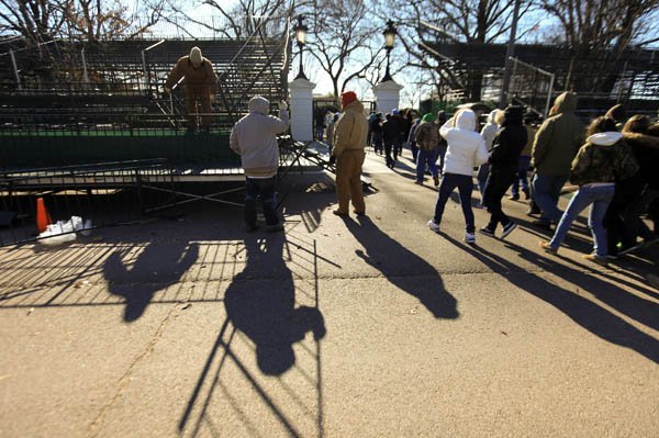 Workers set up fencing along Pennsylvania Avenue on Friday during inauguration preparations in Washington, D.C.