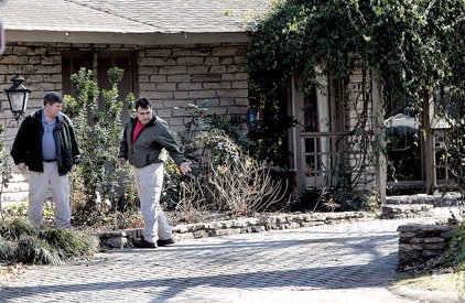 Investigators on Friday examine the West Memphis home of Trent Pierce, who was critically injured in an explosion Wednesday.