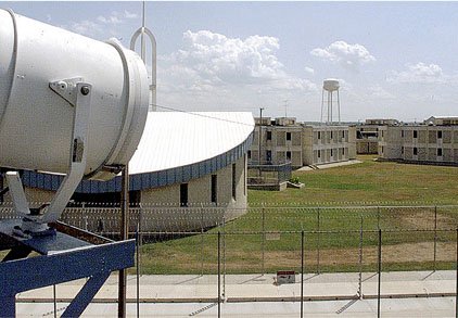 A searchlight on a guard tower at the Arkansas Department of Correction's Cummins Unit overlooks a fence in this 2001 photo. After several problems at state prisons, Gov. Mike Beebe on Tuesday said it is appropriate that the department conduct its own investigation.